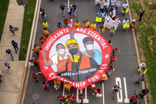  Voces de la Frontera. Washington DC march. September, 2021. Parachute banner design: Claudio Martinez. 