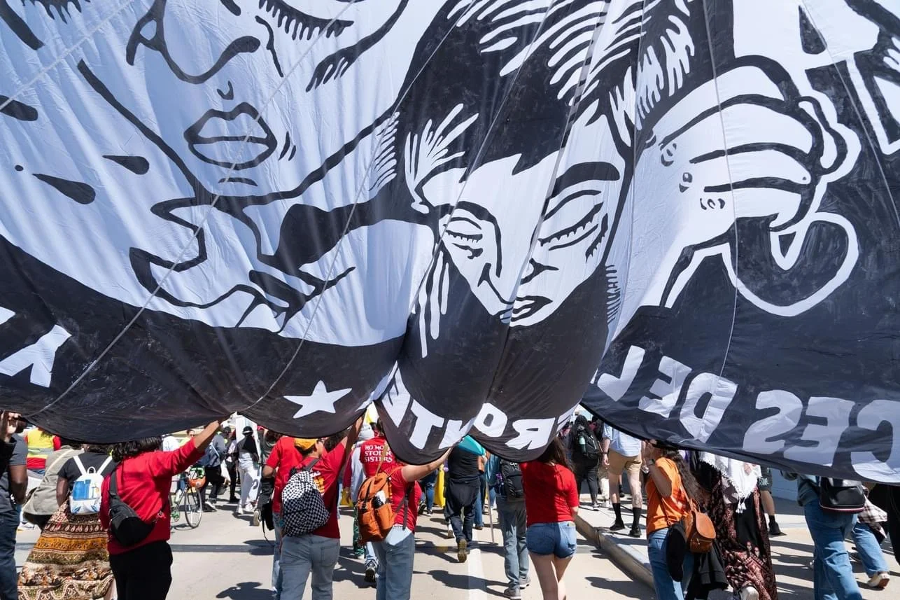  Voces de la Frontera. May Day march 2024. Parachute design by John Fleissner. Photo by Joe Brusky.  