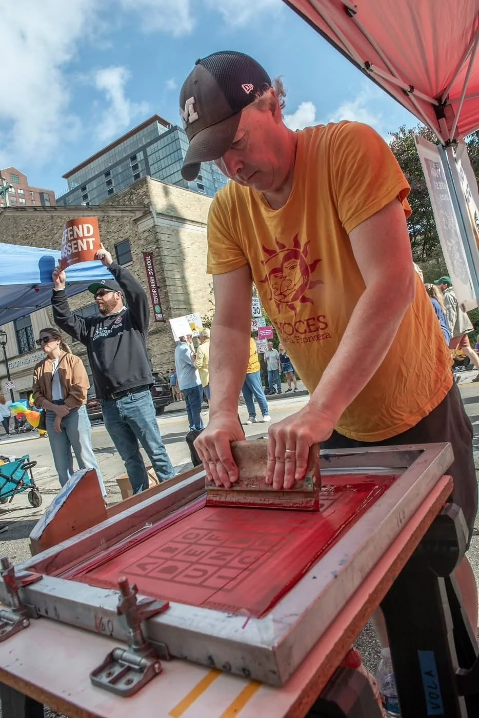  screenprinting in the Voces tent during NO KINGS demo, Milwaukee 