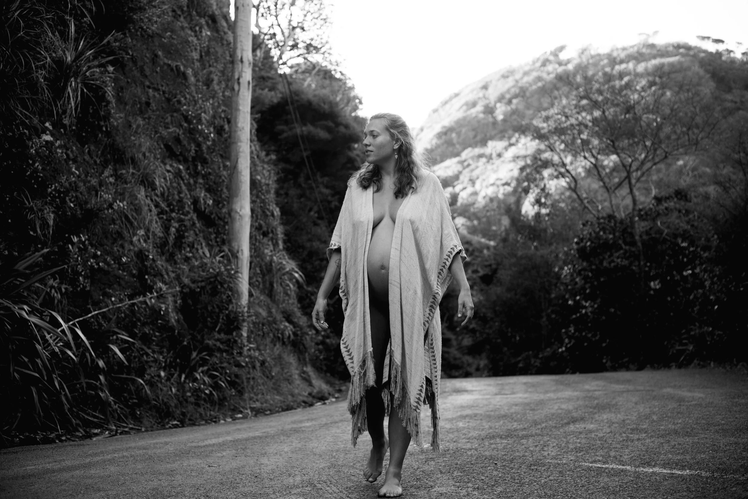maternity documentary photo of woman standing on road