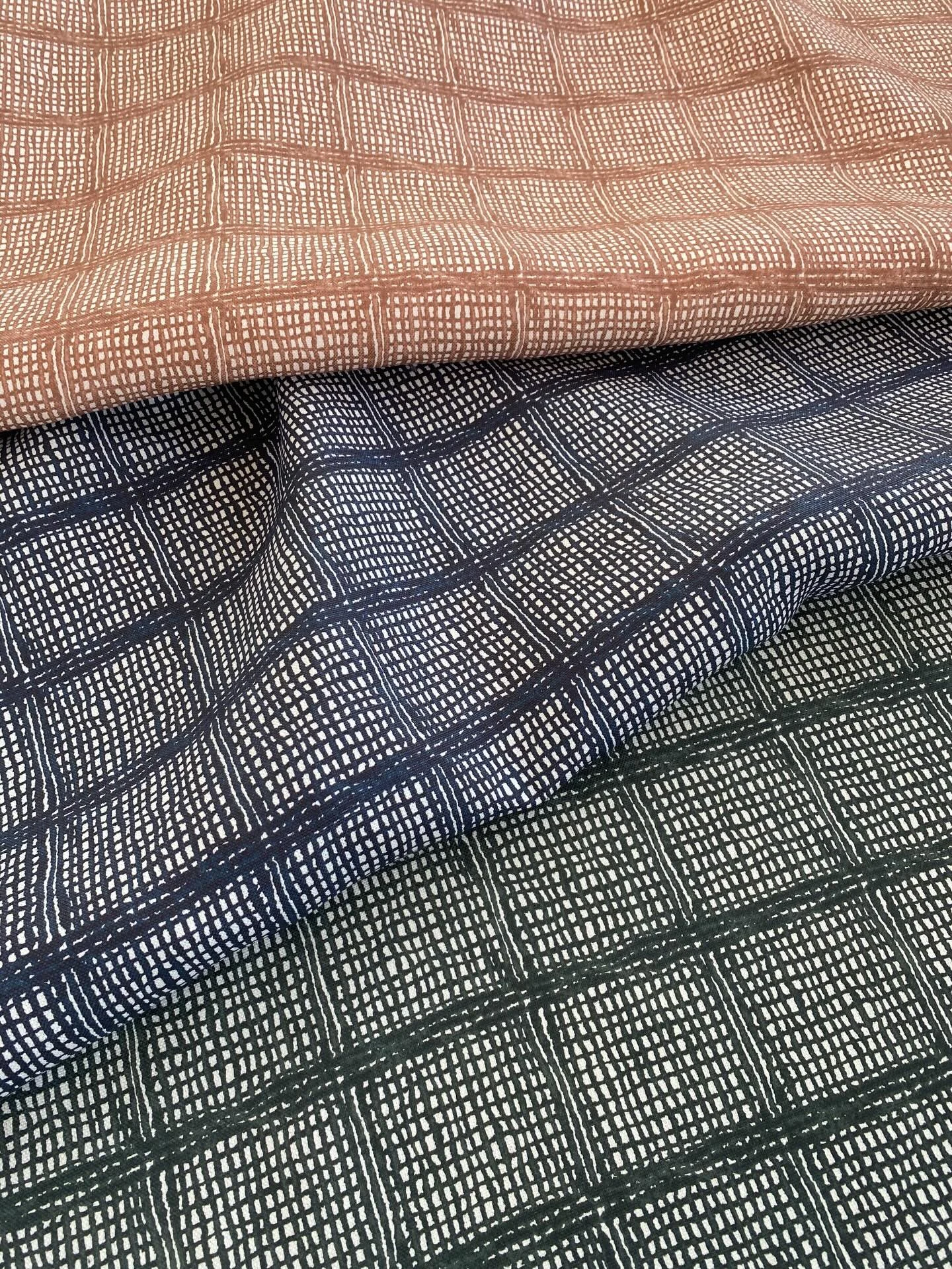 Westchester reimagines the classic plaid through the lens of handcraft. Originating from our hand-stitched Shibori artwork, the pattern reveals subtle texture and depth where each stitch once guided the dye.

Samples available through our trade partn