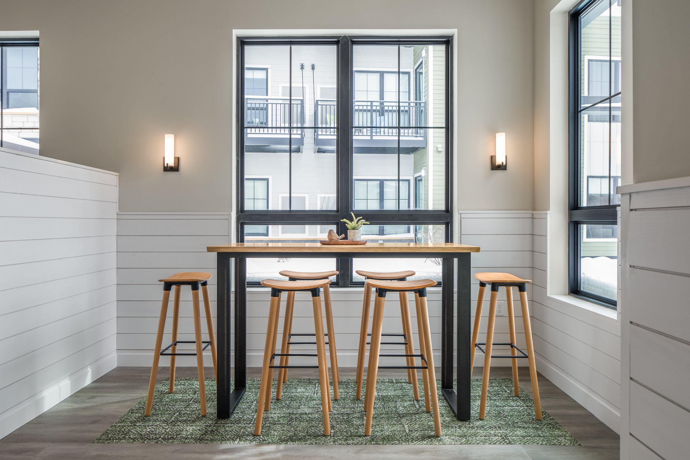 Interior photograph of common area in The Woodspire Apartments in Eau Claire, WI. Interior design by Atmosphere Commercial Interiors.
