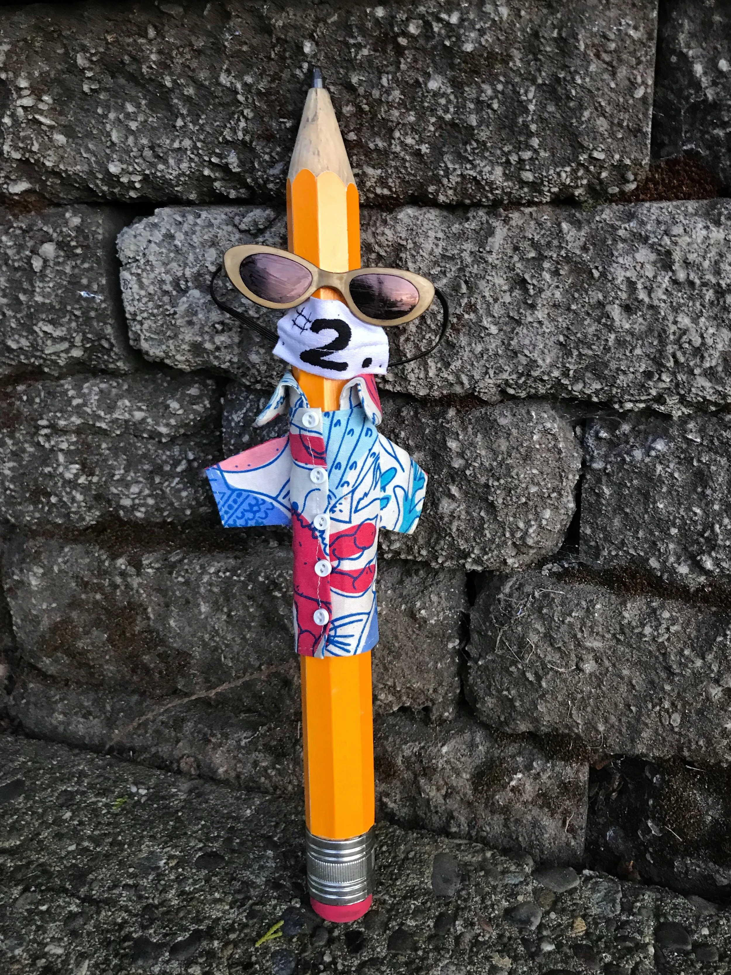 The Guild’s mascot, Giant Pencil, demonstrates proper (and stylish!) mask use. Photo credit: Jill Walters.