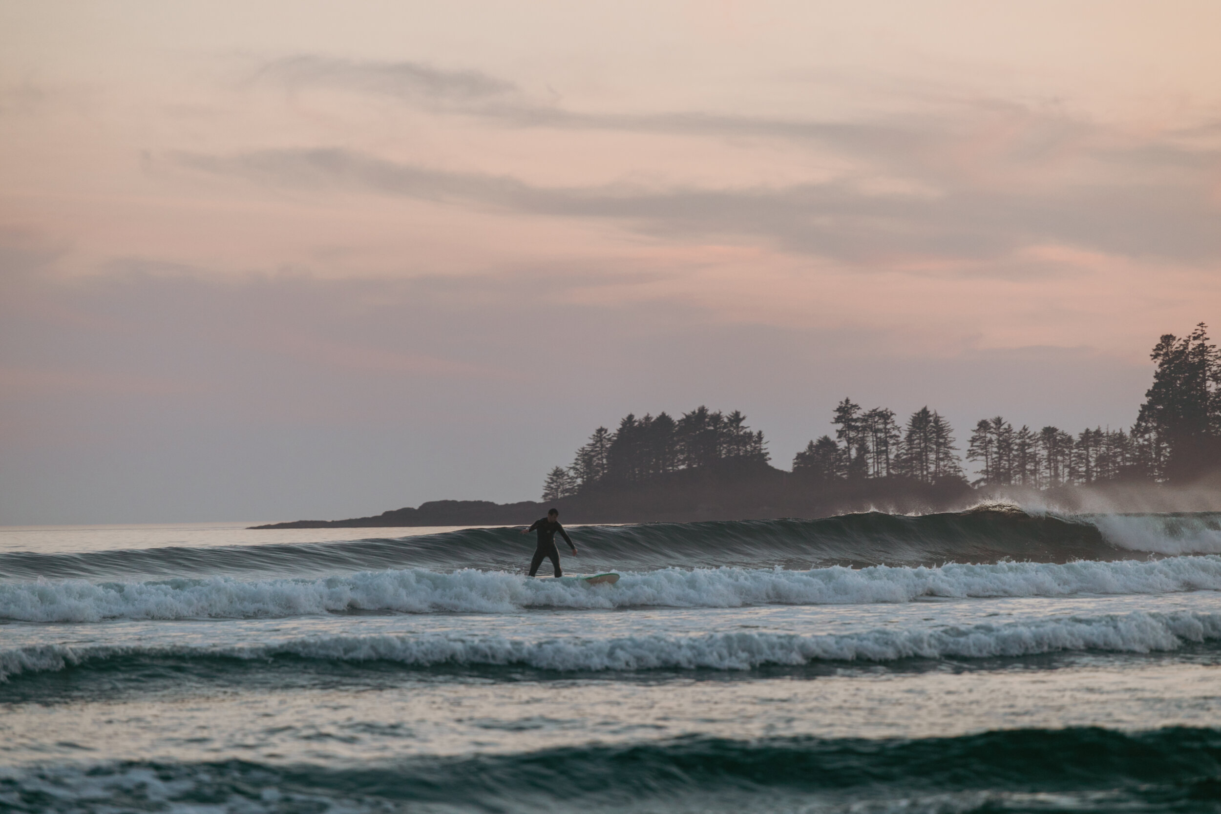 Surfing the waves at Long Beach in Tofino