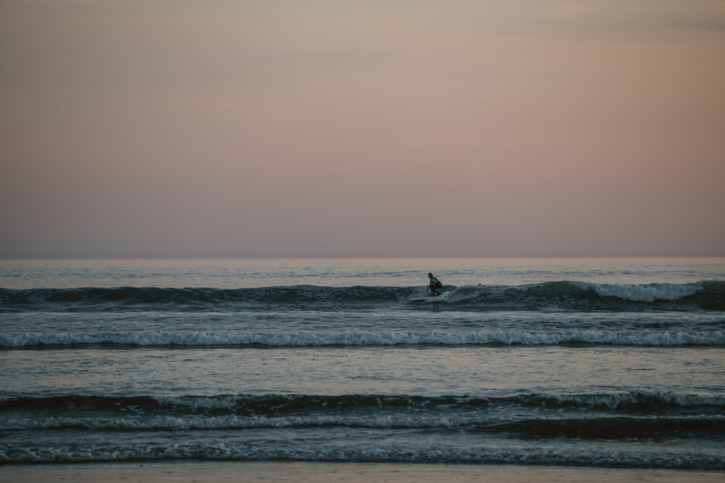 Surfing during sunset in Tofino