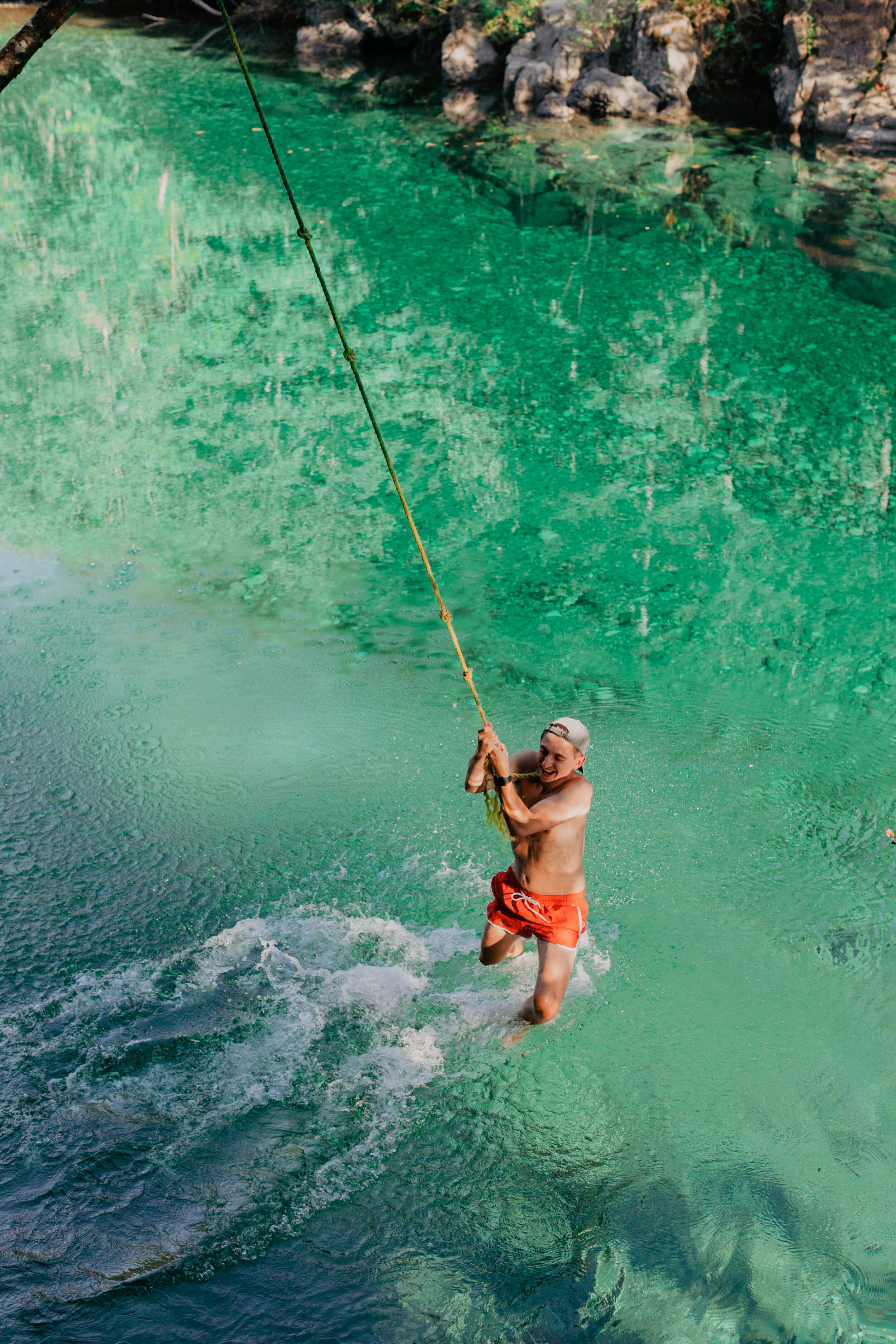 Person on the rope swing at the Taylor River Rest Area