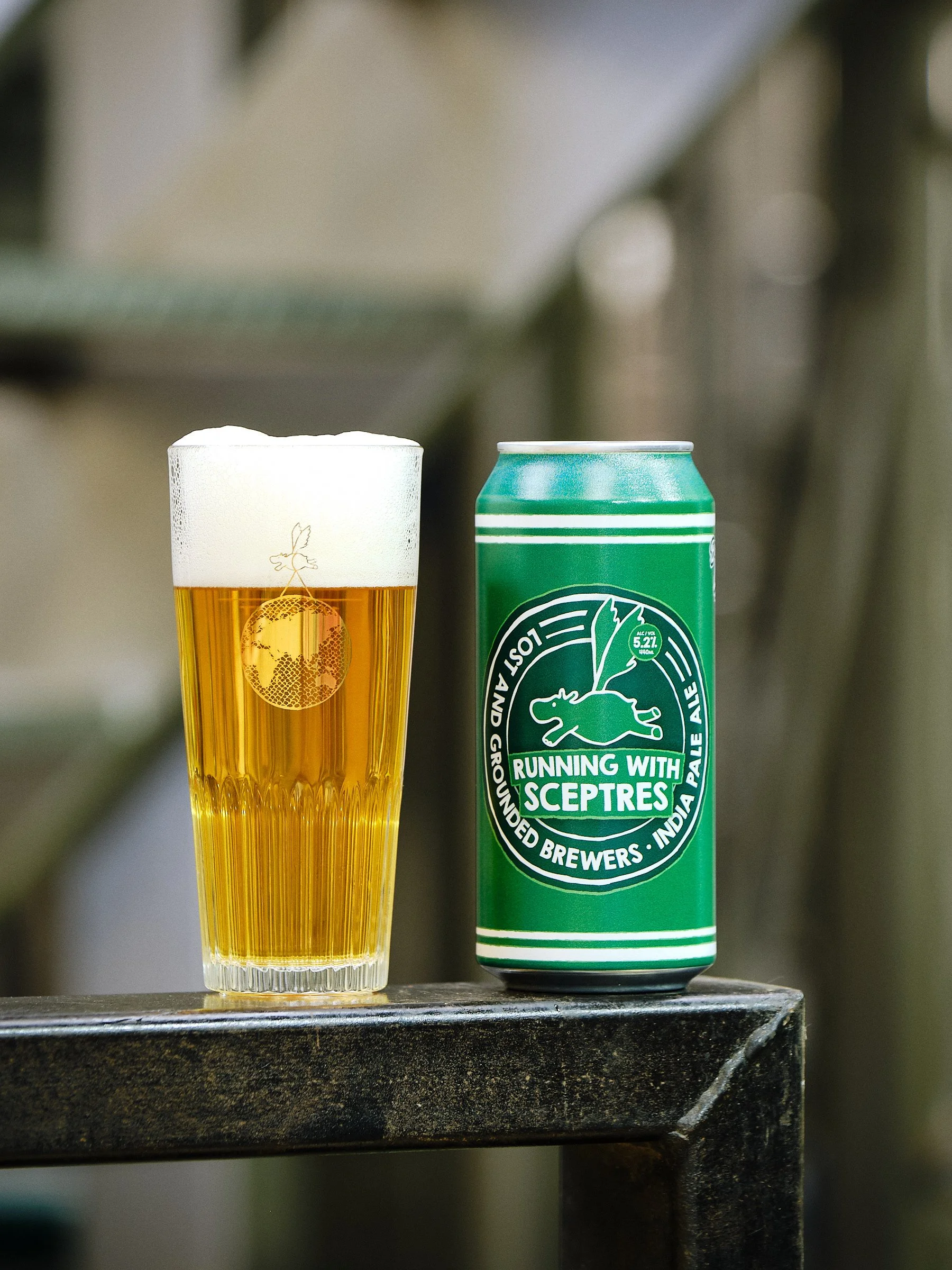 A can of Lost and Grounded Running with Sceptres (India Pale Ale, 5.2%), next to a filled glass.