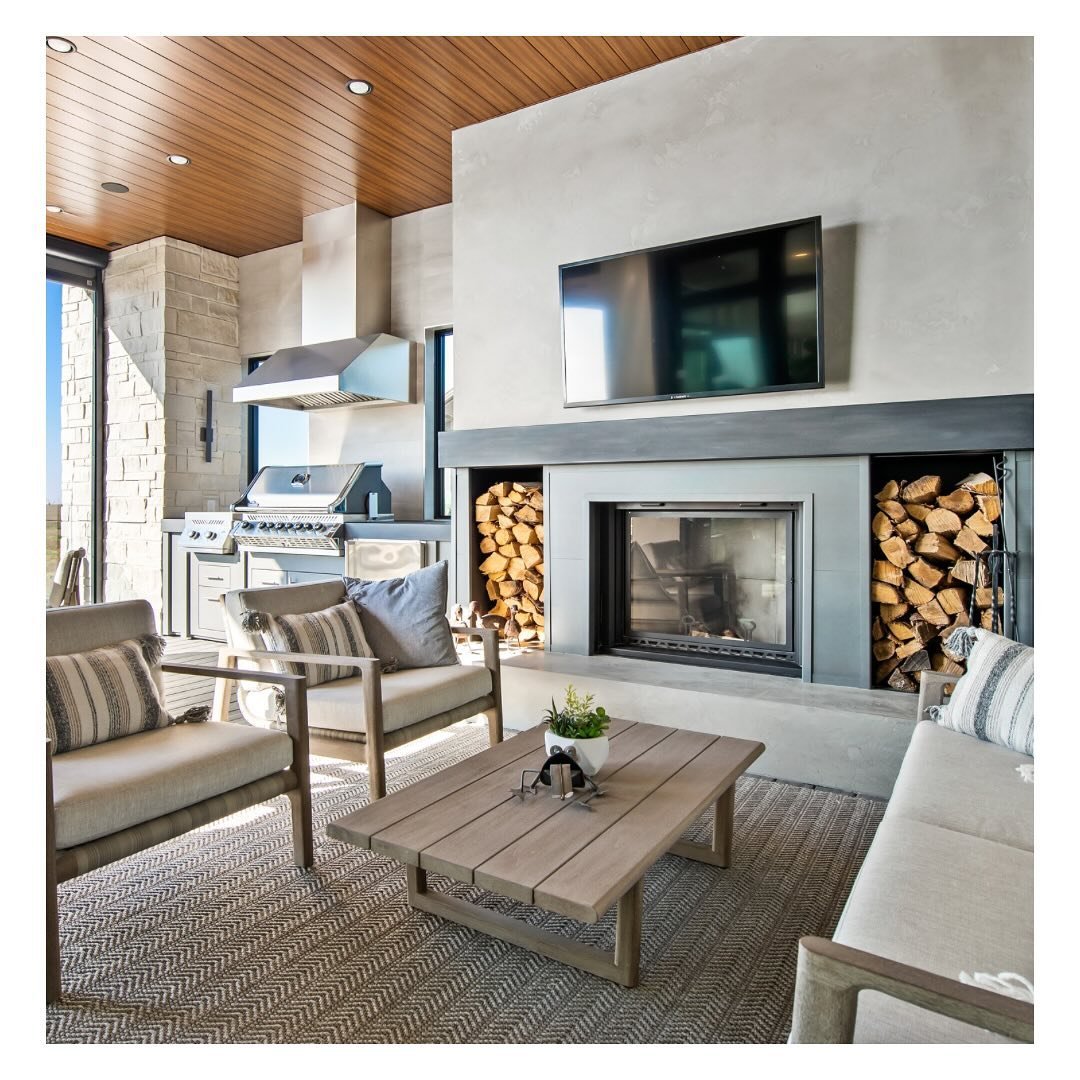 As the weather swings back and forth between snow, rain, snow, sun, snow, wind we&rsquo;re reminiscing about the function and comfort of this 3-season room we designed, complete with a fireplace, TV, outdoor kitchen and BBQ, heat &amp; retractable bu