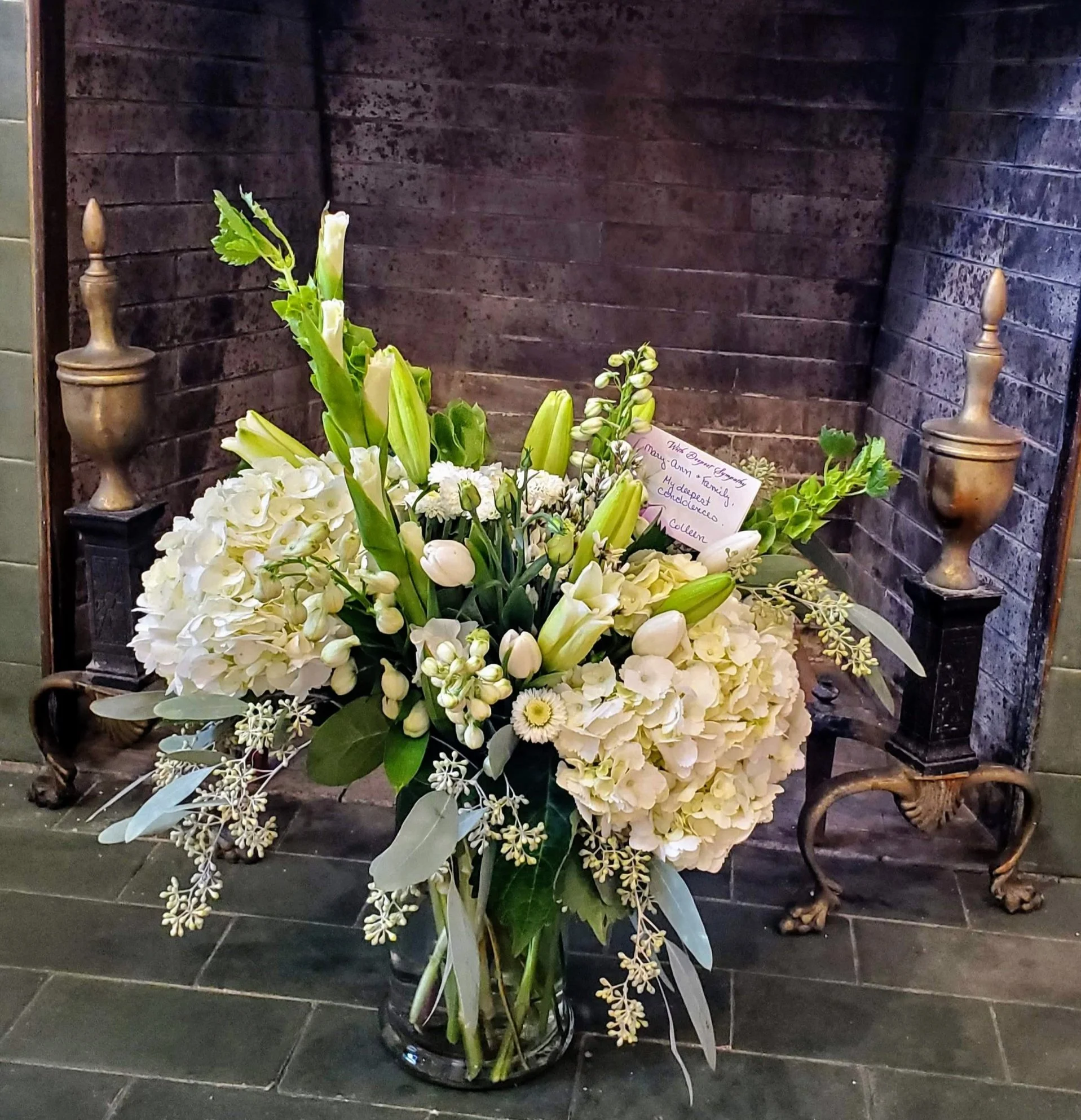White, textured funeral design - $125 to $250