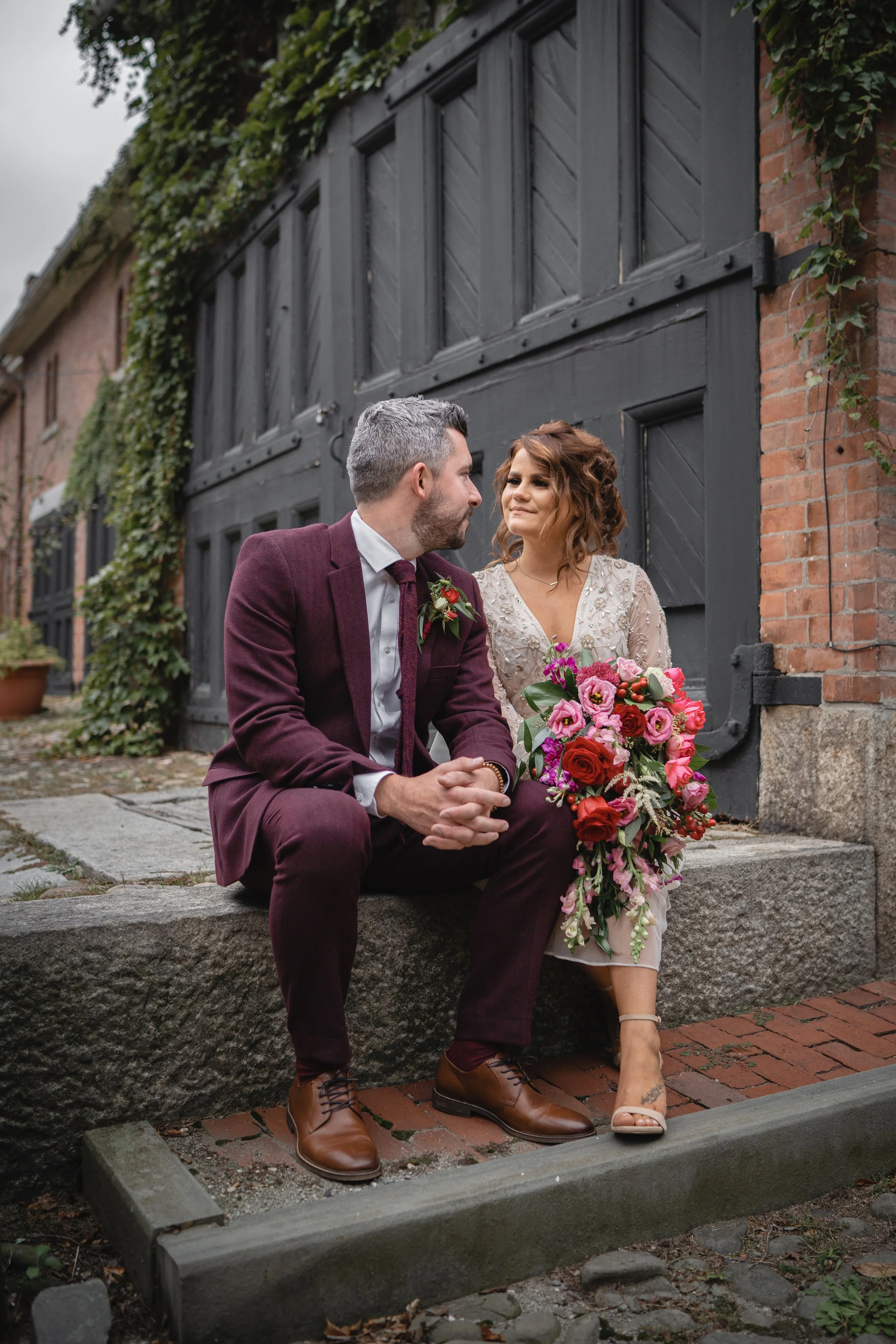 Beautiful cascading bridal bouquet in reds and pinks.
