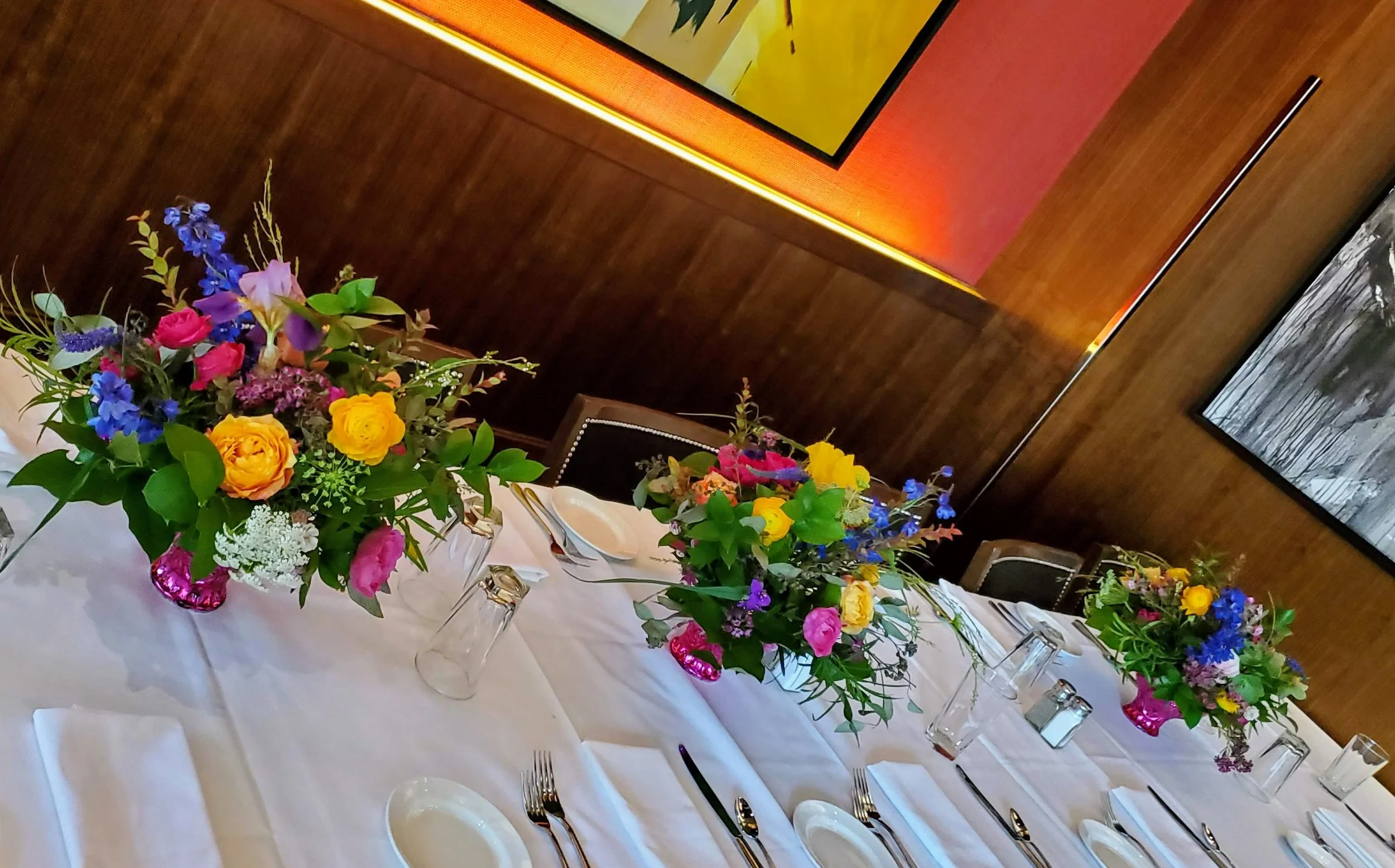 Bright, bold design with delphinium, free spirit roses, and much more