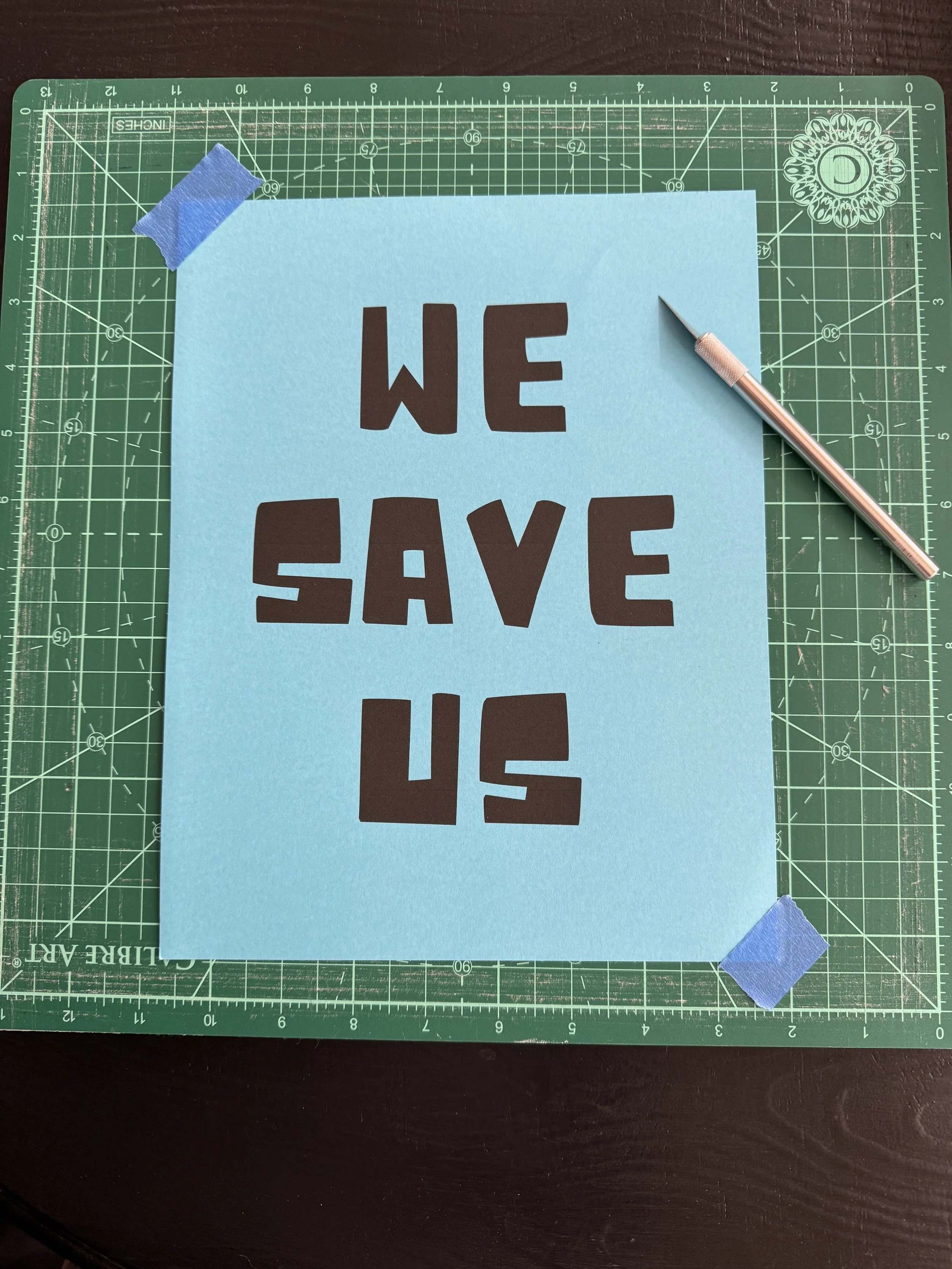 Print out your stencil of choice.
Tape to your cutting board.
Use the x-acto to cut out the letters/images.
