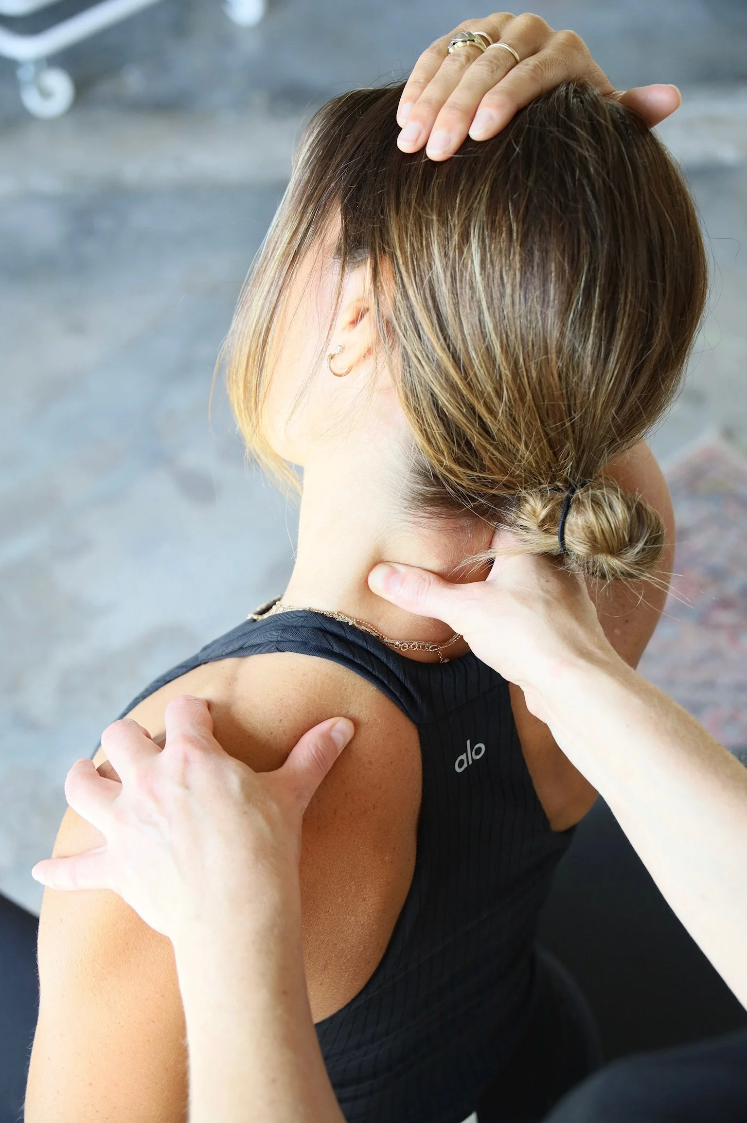 Myofascial release therapy on a patient's neck and shoulders at Wholistic Abode in Newport Beach