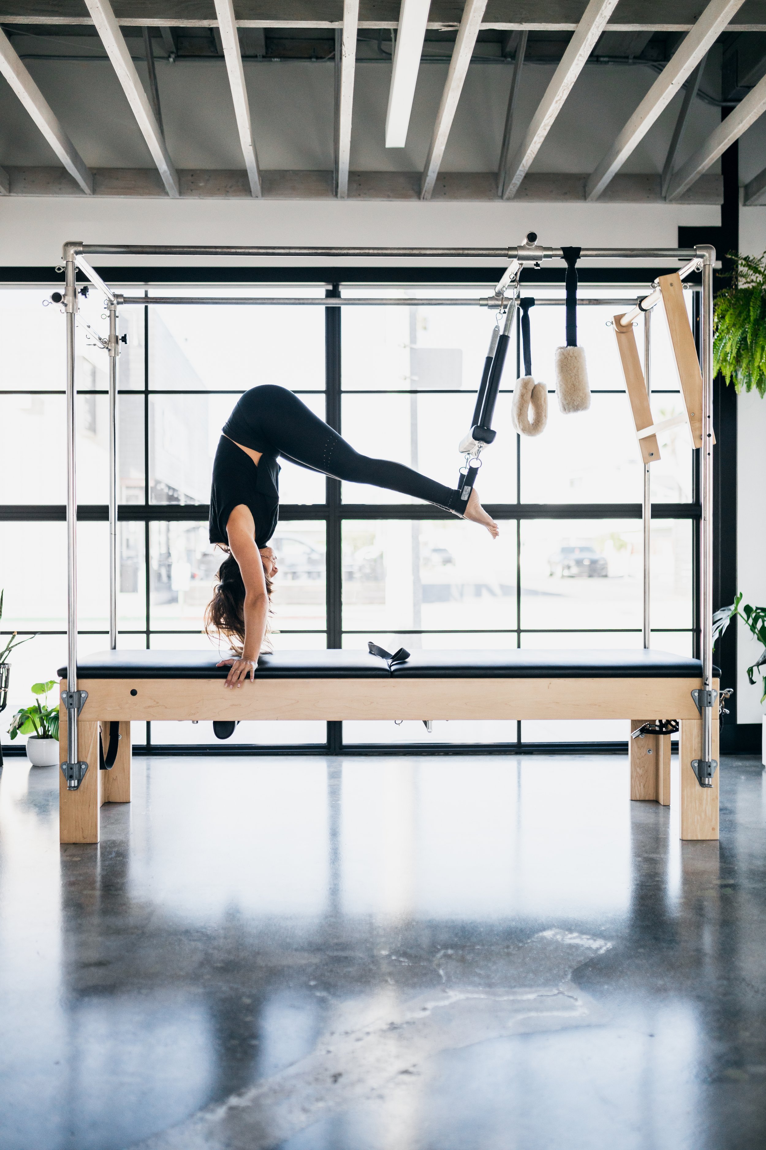 One-on-one clinical reformer Pilates session at Wholistic Abode in Newport Beach