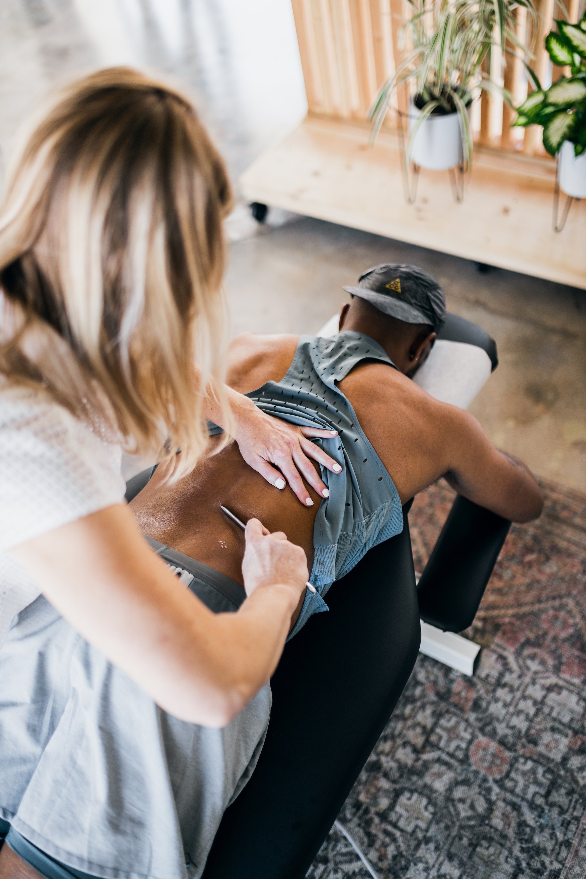 Cupping therapy and IASTM soft tissue treatment at Wholistic Abode chiropractic studio in Newport Beach