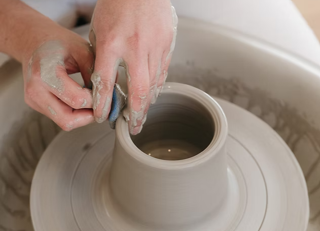 The Clay Club pottery class making a cup