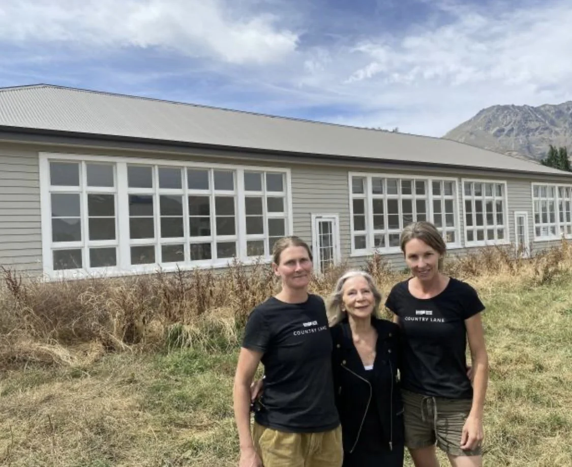 Annika Grant, Diane Hart and Tineke Enright standing outside of the School House Studios Building at Country Lane Queenstown.