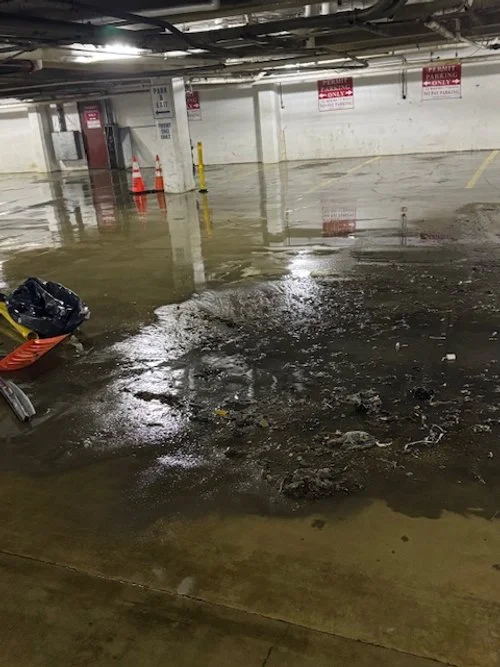 parking garage floor before pressure washing