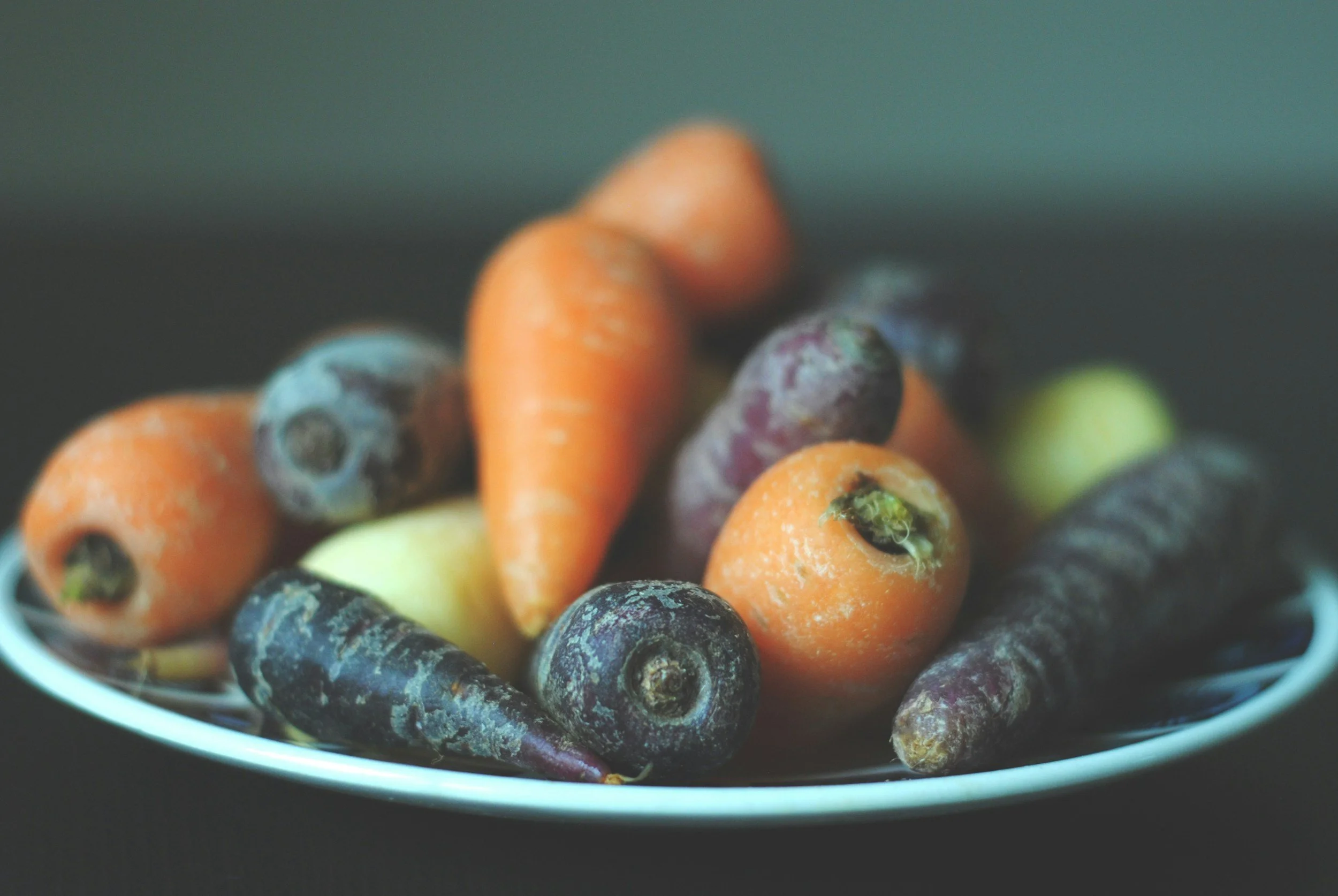 Bowl of carrots in multiple colors