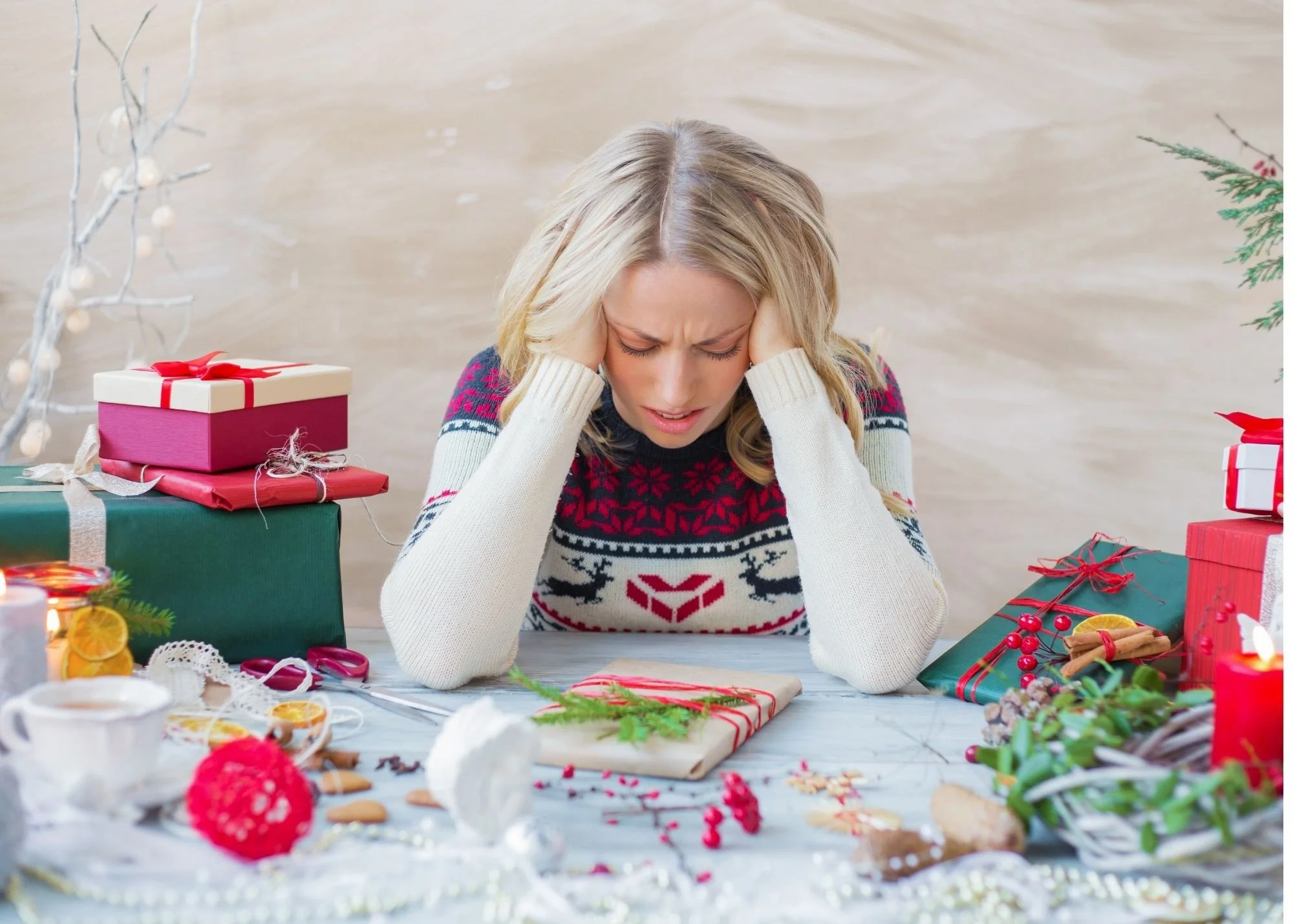Stressed out woman working on wrapping holiday gifts