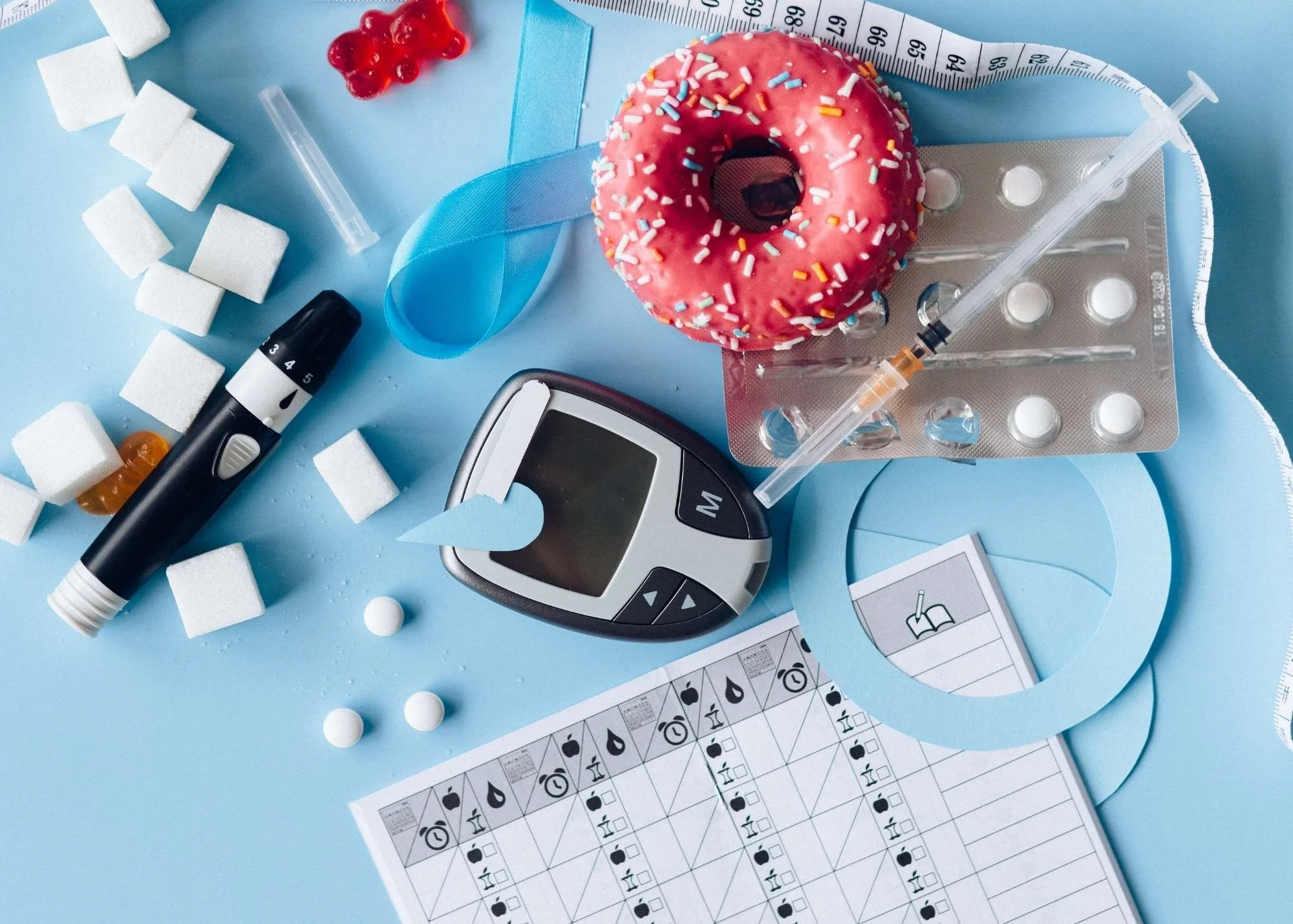 A mix of  diabetes items on a blue background