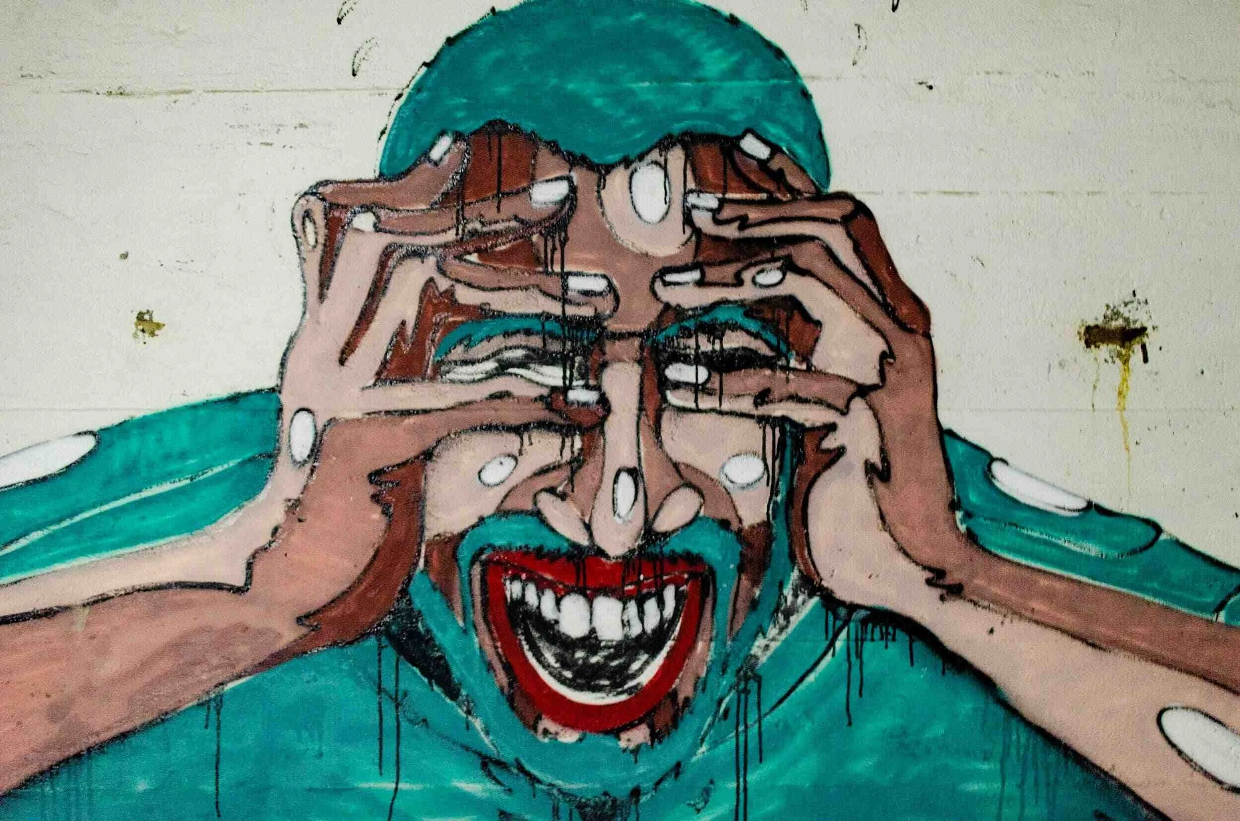 Artist picture of man grabbing his head from pain, East West Wellness