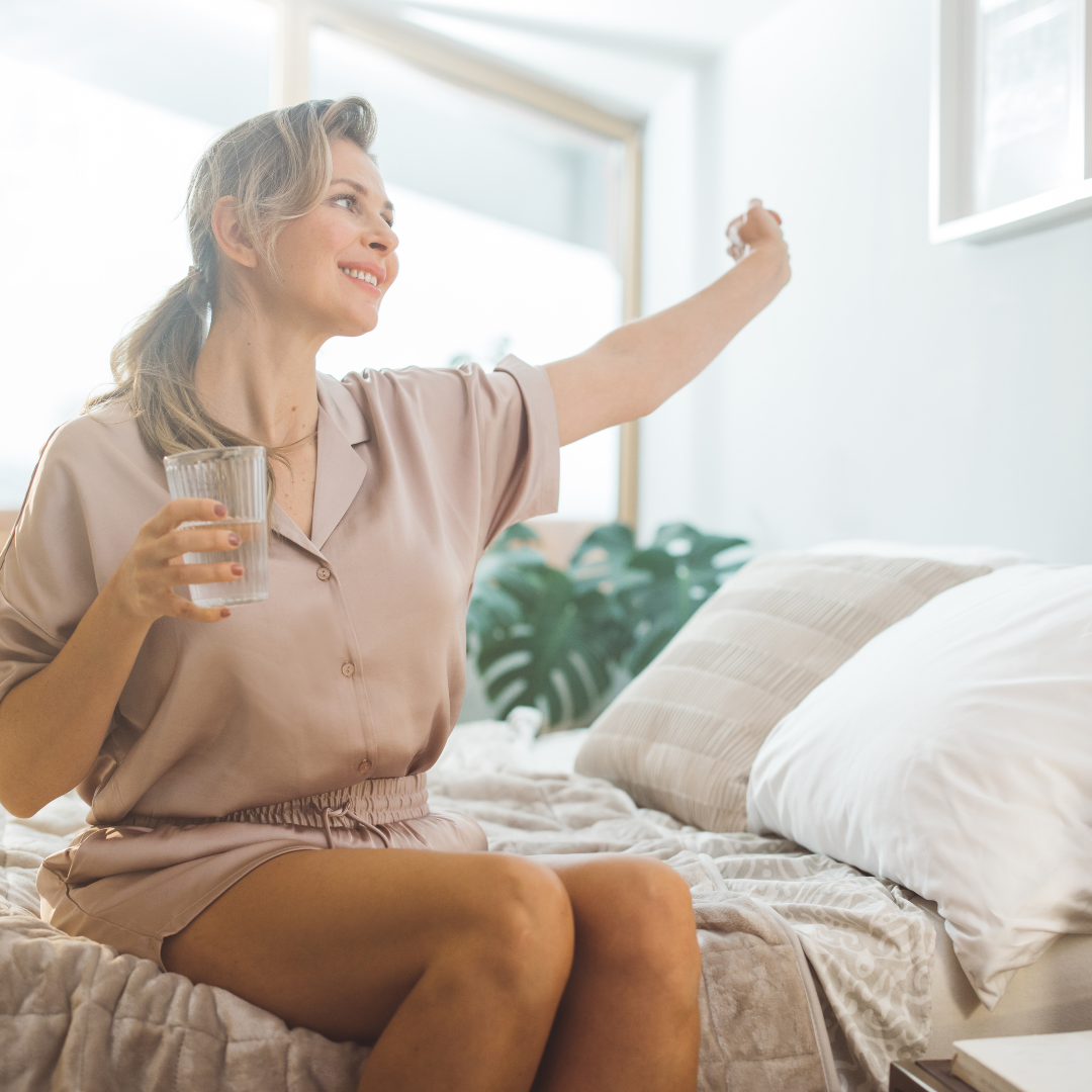 Woman waking up feeling refreshed from a good night sleep
