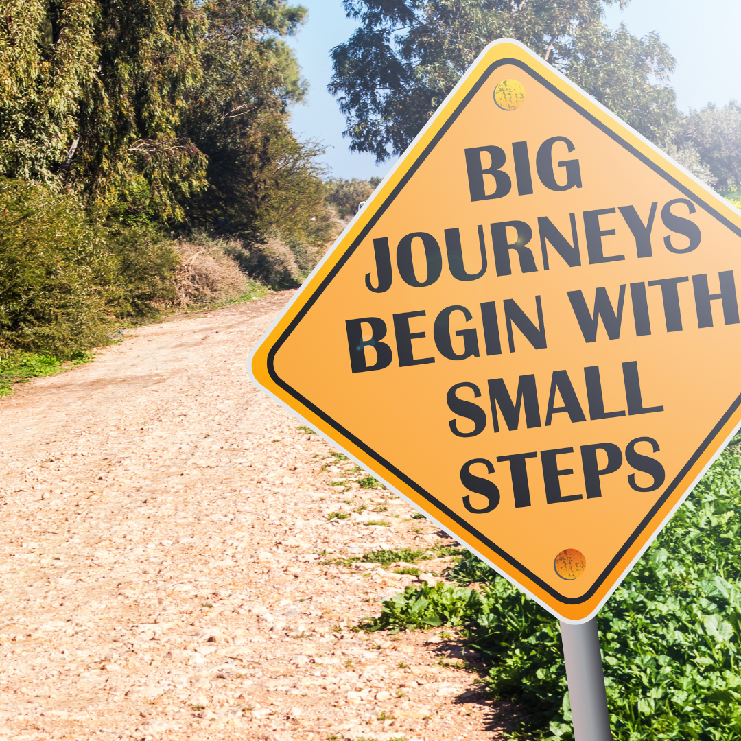 A beautiful outdoor trail with entry sign saying "Big Journeys Begin With Small Steps"