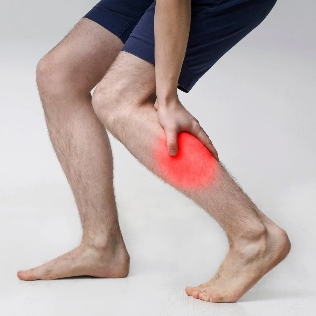 Man holding his calf in pain