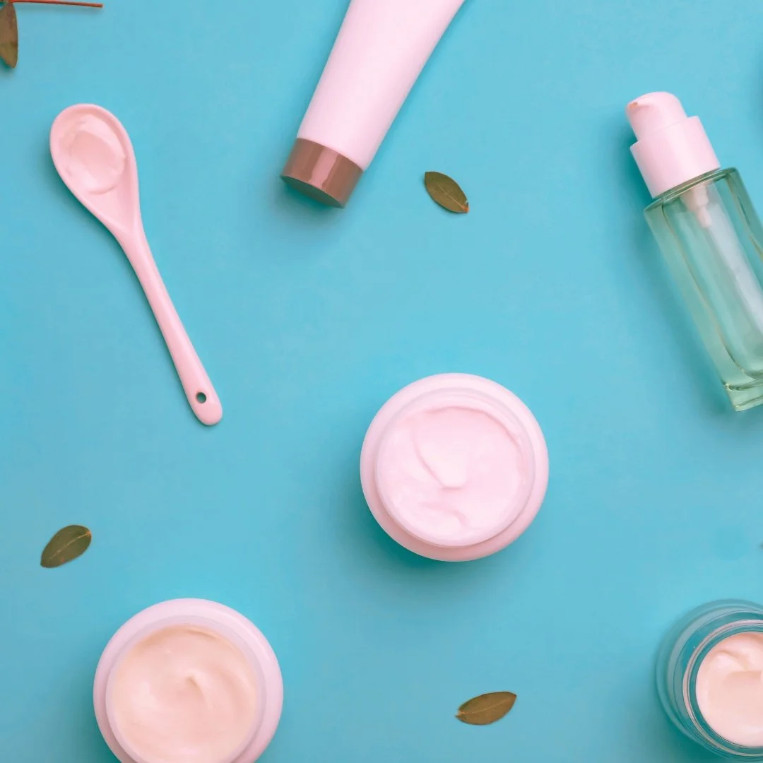 Pink face products on a blue background
