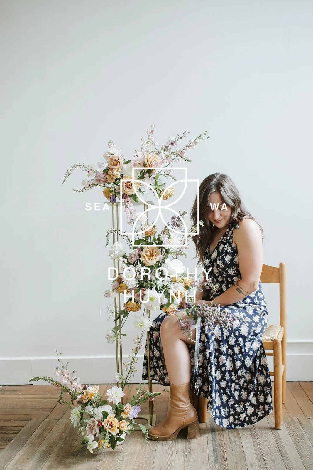 Seattle wedding and event florist creating bespoke floral installation of blooming branches, romantic garden roses, and seasonal dahlias. 