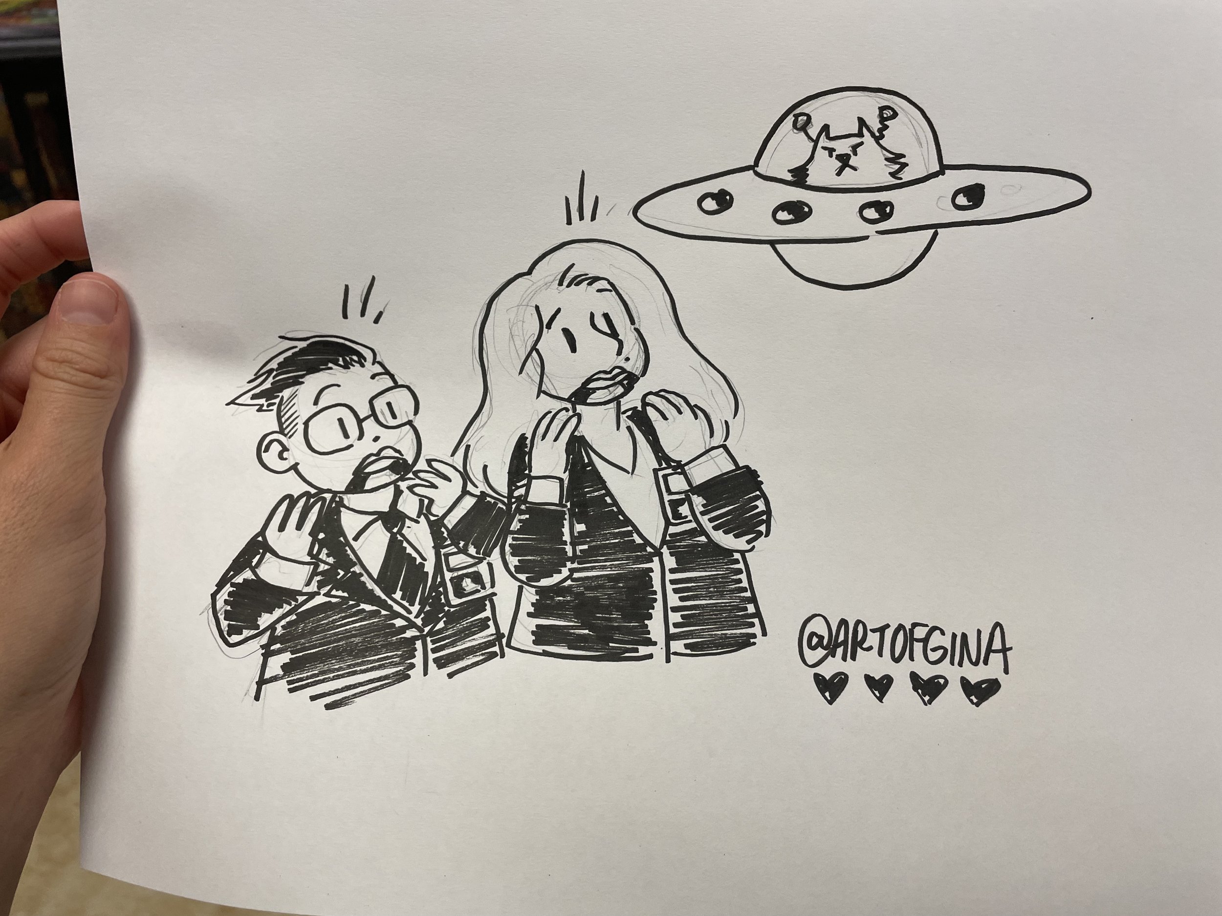  A sketch I did for Heather and Nicole during Alternate Reality Comic’s Grand Opening event for their new shop. I still love it. Heather and Nicole are Mulder and Scully and their cat Biscuit is an alien.  