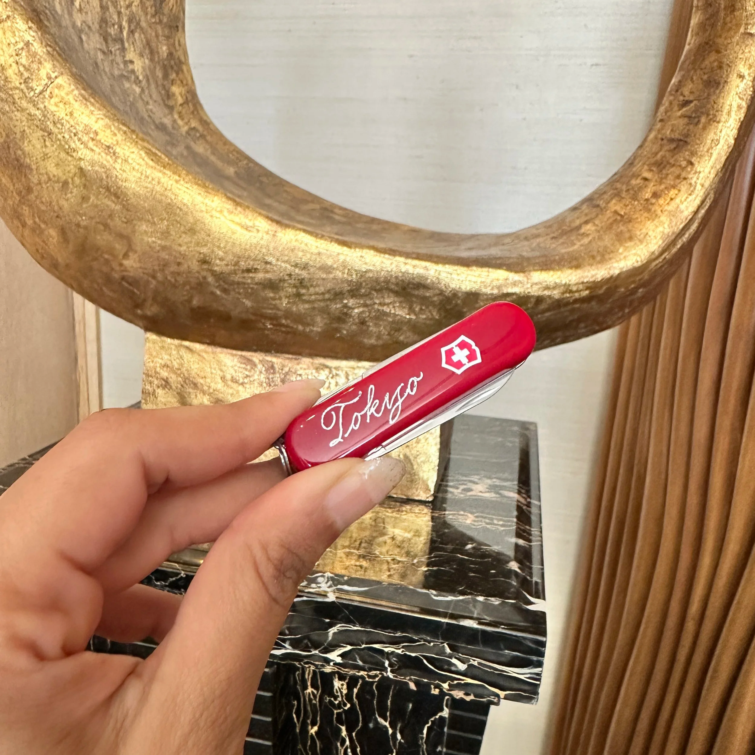 On-site Calligraphy Heat Foiling on Swiss Army Knives for client event in Hong Kong