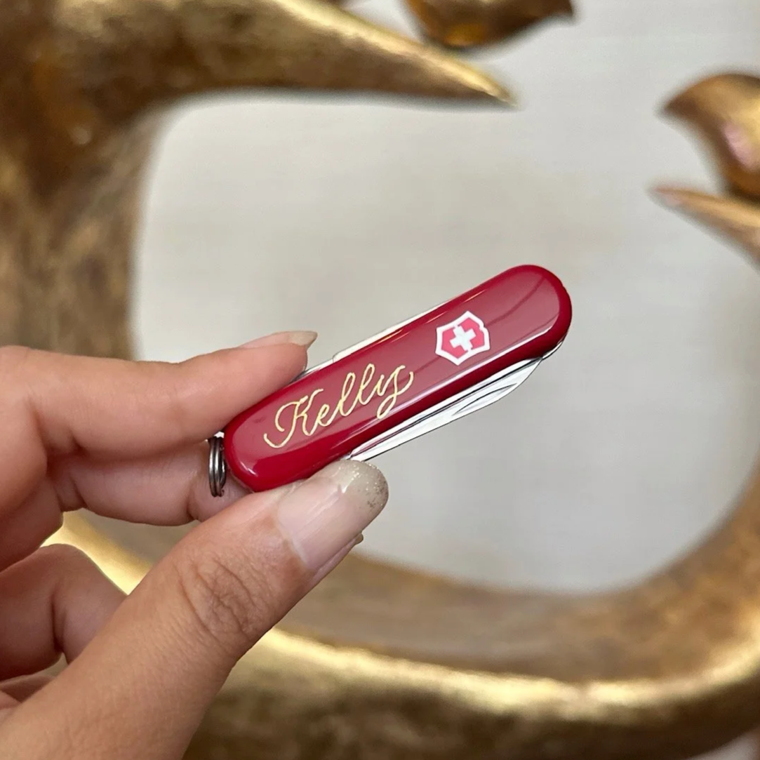 On-site Calligraphy Heat Foiling on Swiss Army Knives for client event in Hong Kong