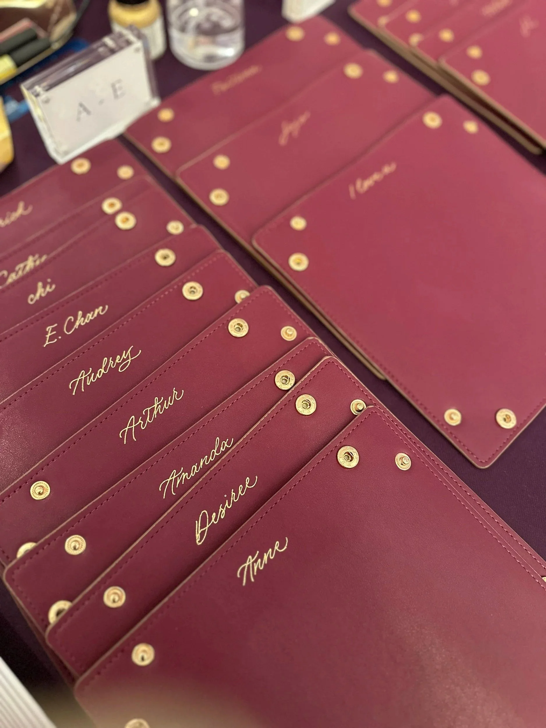 On-site Calligraphy Heat Foiling on Leather trays for conference in Hong Kong