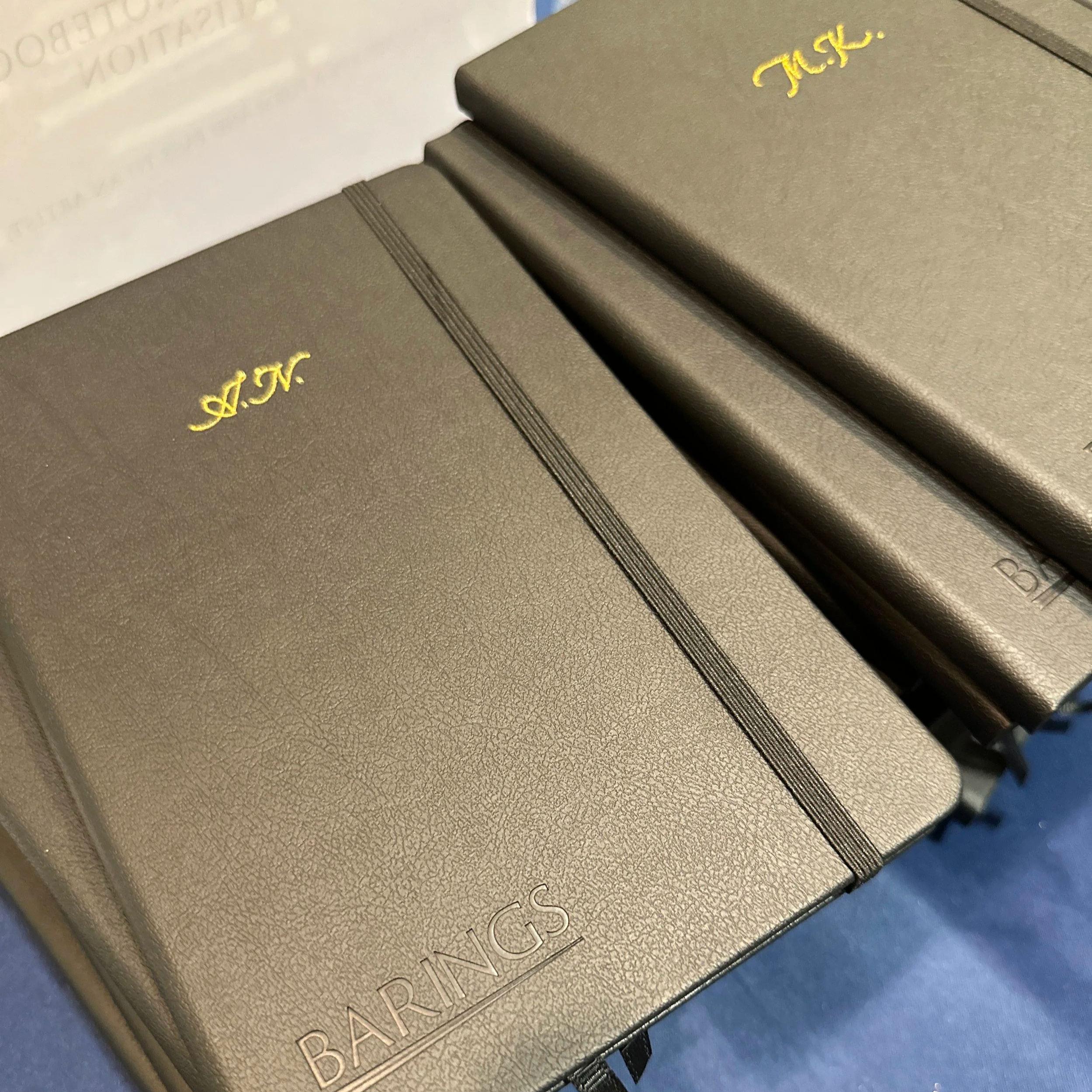 On-site Calligraphy Heat Foiling on notebooks for client event in Hong Kong