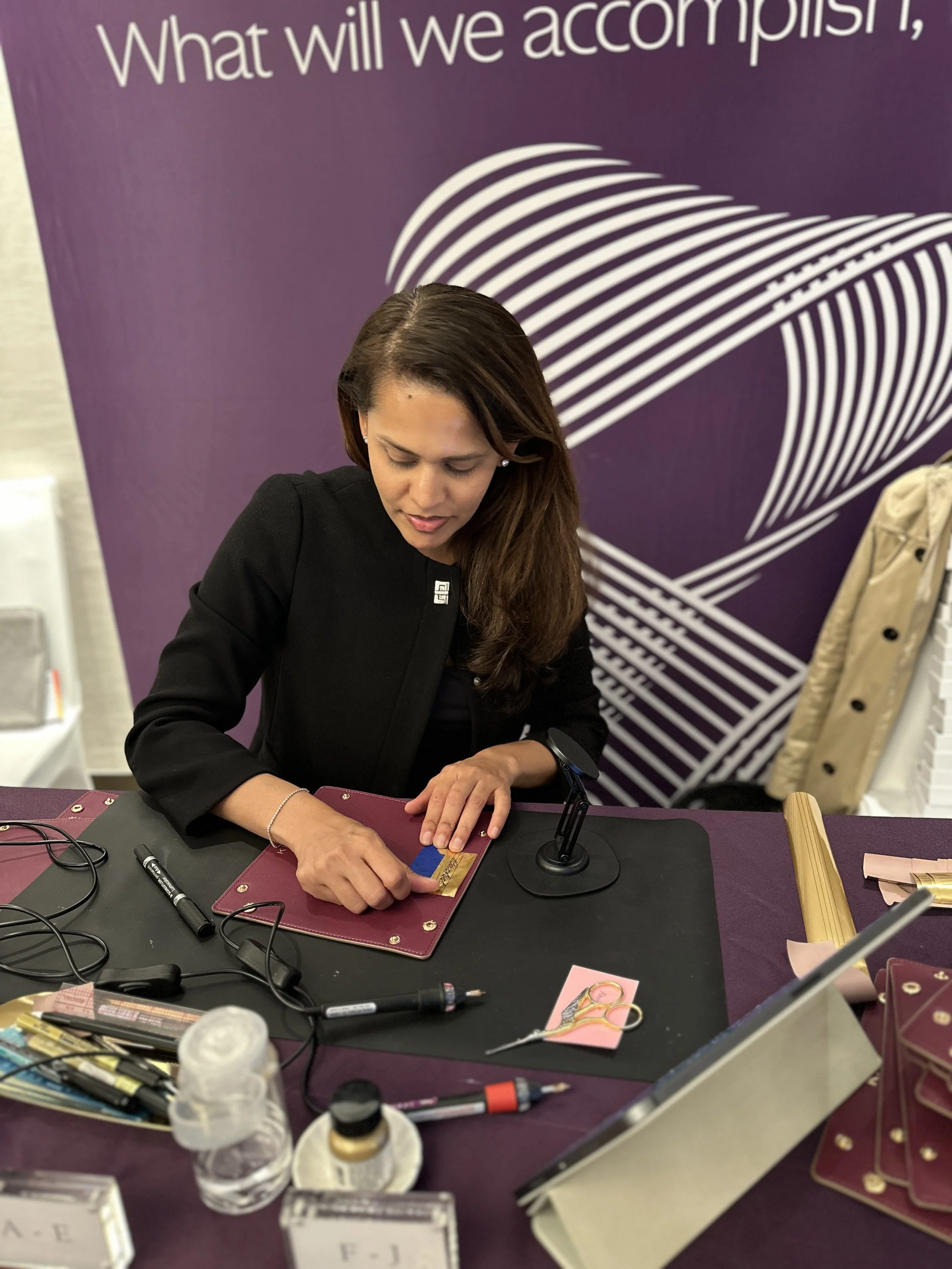 On-site Calligraphy Heat Foiling on Leather trays for conference in Hong Kong