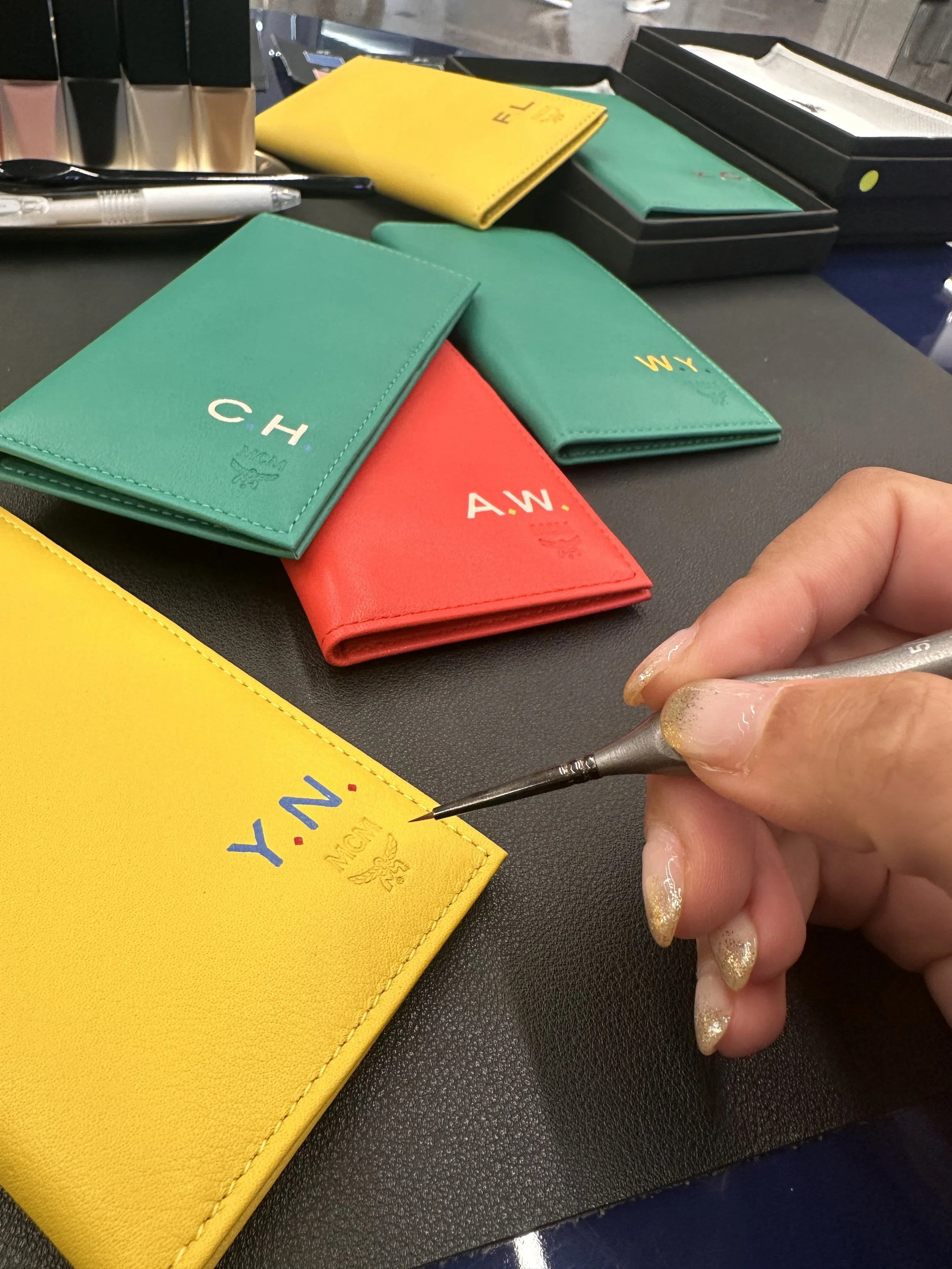 On-site Monogram Painting on Passport Wallets Hong Kong