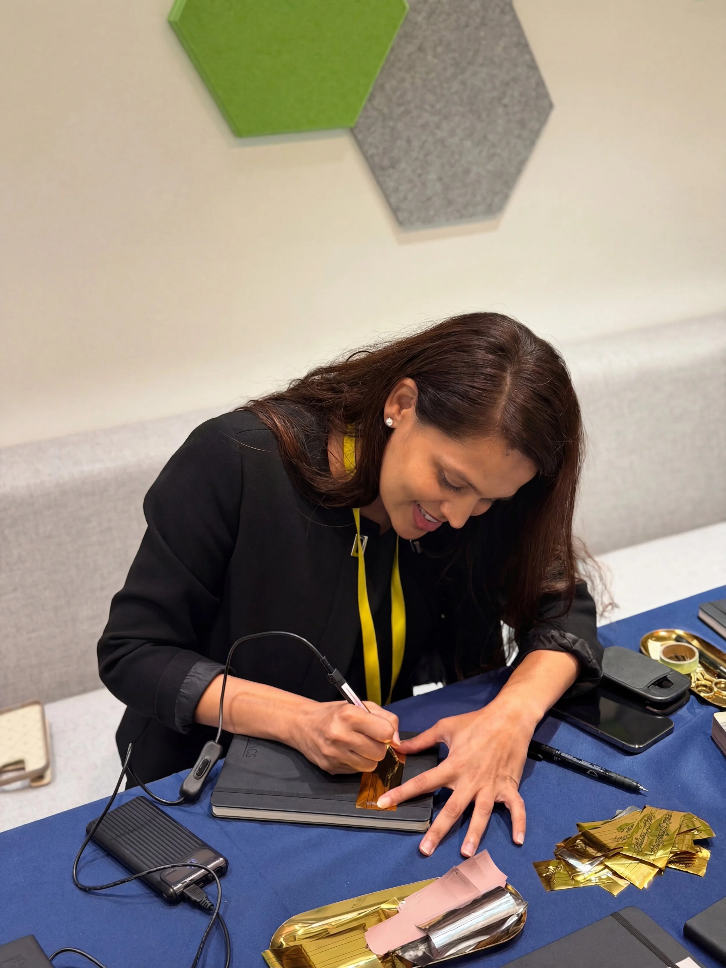 On-site Calligraphy Heat Foiling on notebooks for client event in Hong Kong