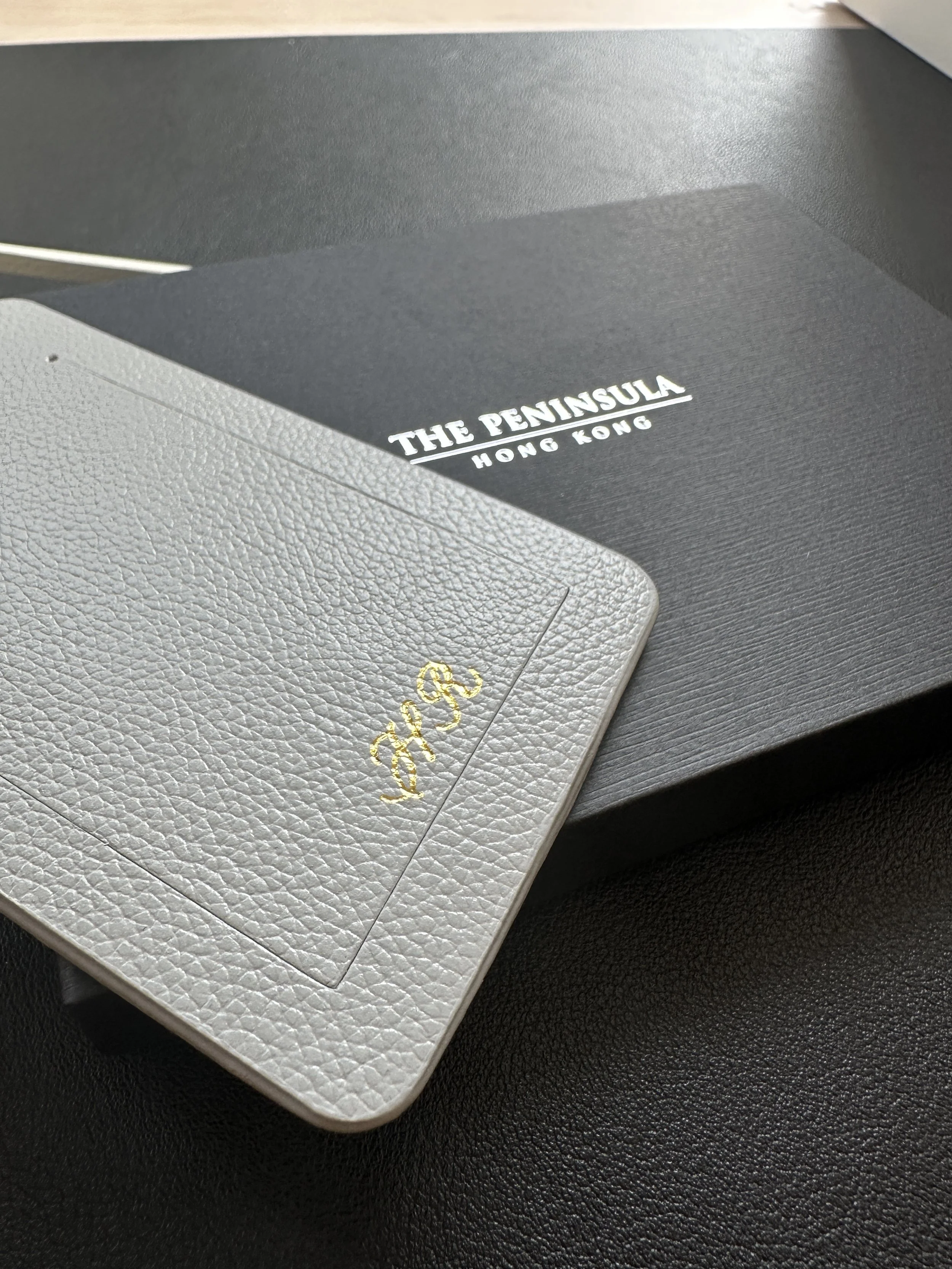 Heat Foiling Personalisation on luggage tags for The Peninsula Hong Kong