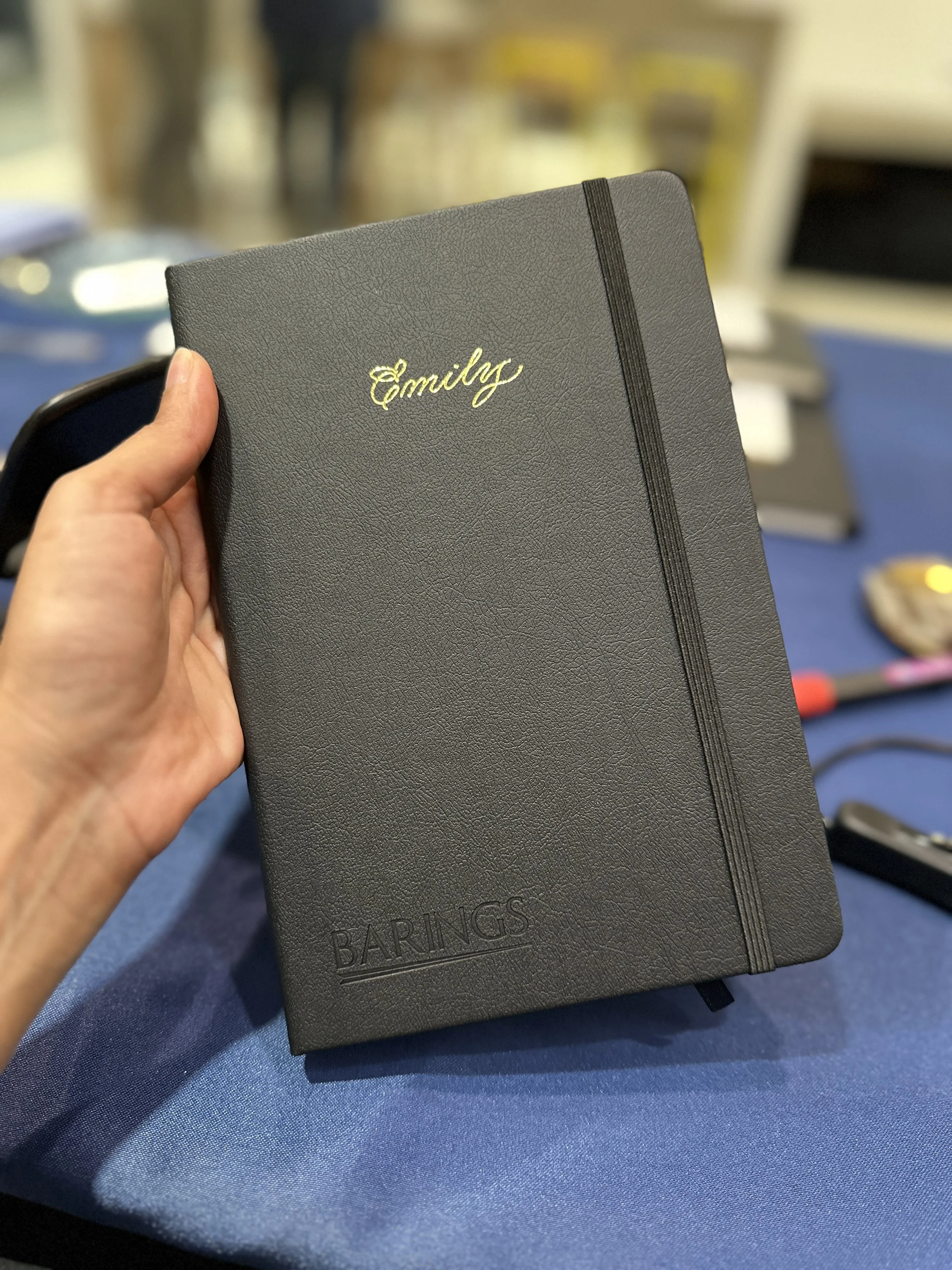 On-site Calligraphy Heat Foiling on notebooks for client event in Hong Kong