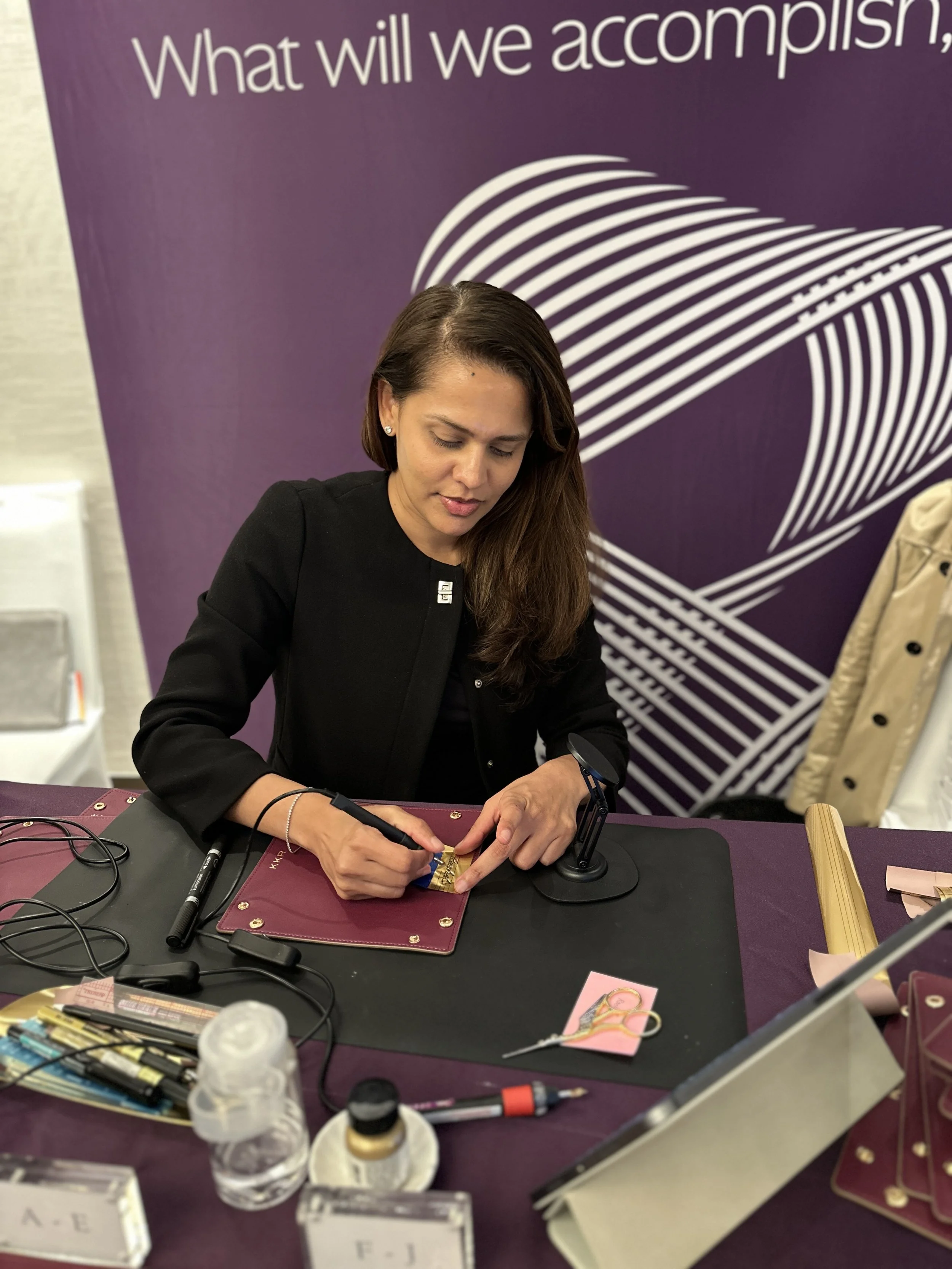 On-site Calligraphy Heat Foiling on Leather trays for conference in Hong Kong