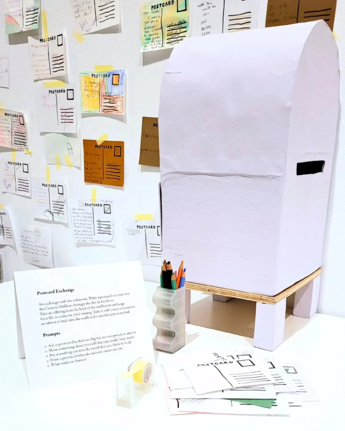 An exchange with the unknown. 

In the exhibition Maura Doyle: Dear Universe there is an invitation for you, the viewer, to contribute. Write a postcard to the universe or a fellow human through the Cosmos Mailbox or receive a postcard from a strange