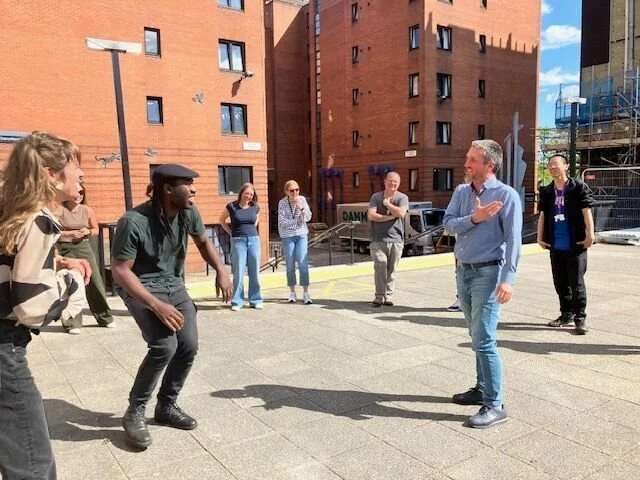 Group of people outside playing a game.
