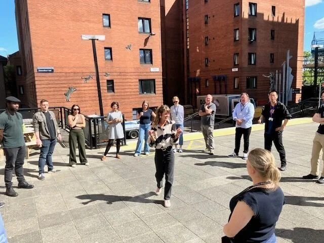 Group of people outside playing a game.