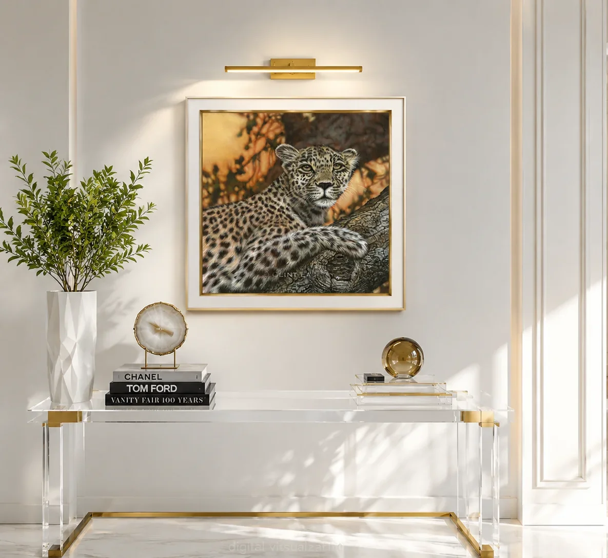 A square framed painting of a leopard resting in a tree by Clint Eagar displayed above a clear acrylic console table.
