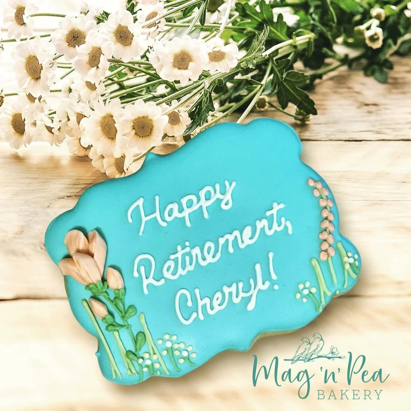 It had been a long time since I&rsquo;d tried my hand at dimensional flowers so I was happy to have the opportunity to to do these retirement cookies with requested peach flowers.

Colors used are from @americolor 
Piping tip used: #101

#magnpeabake