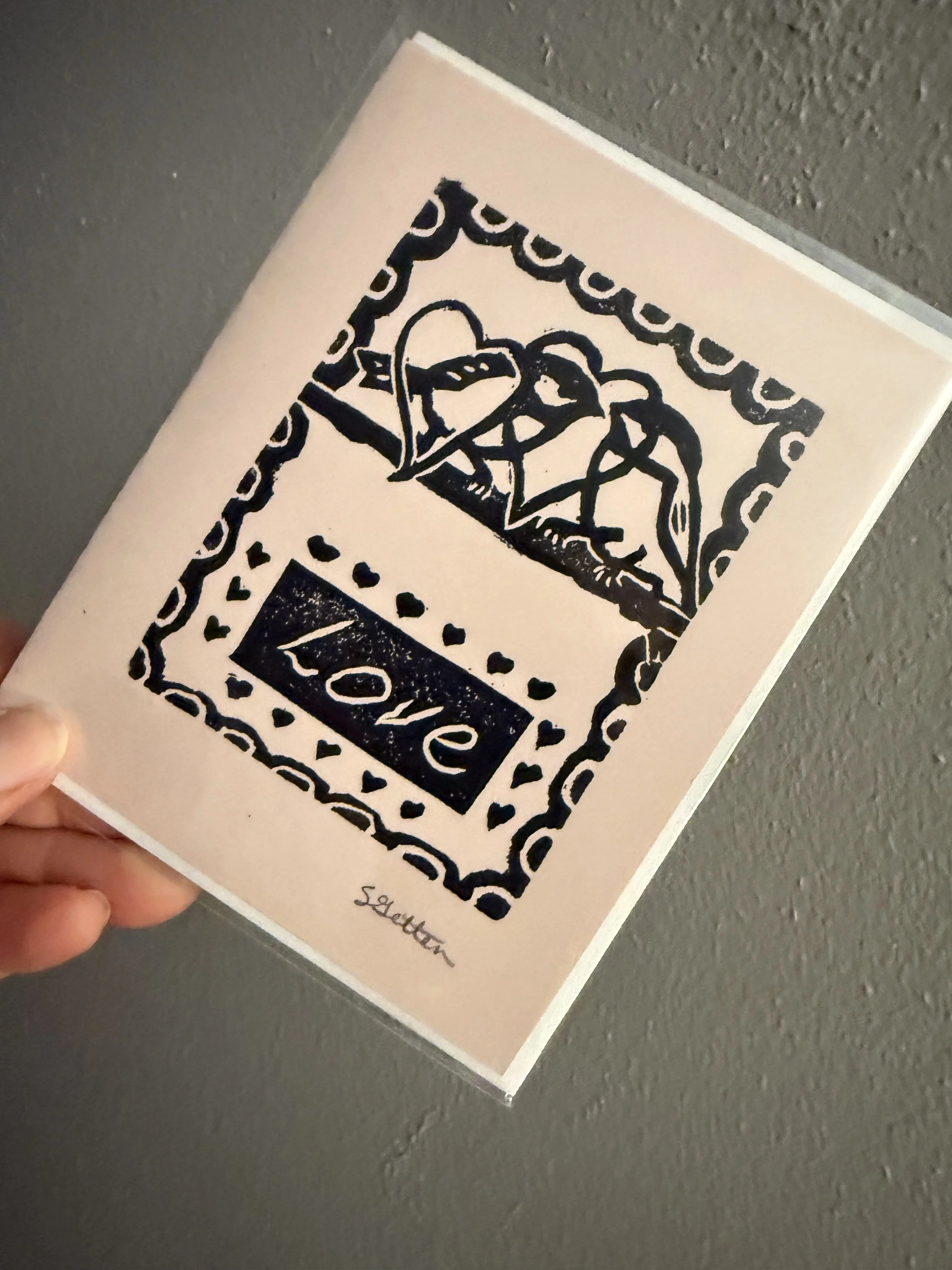 "Love" black on pink