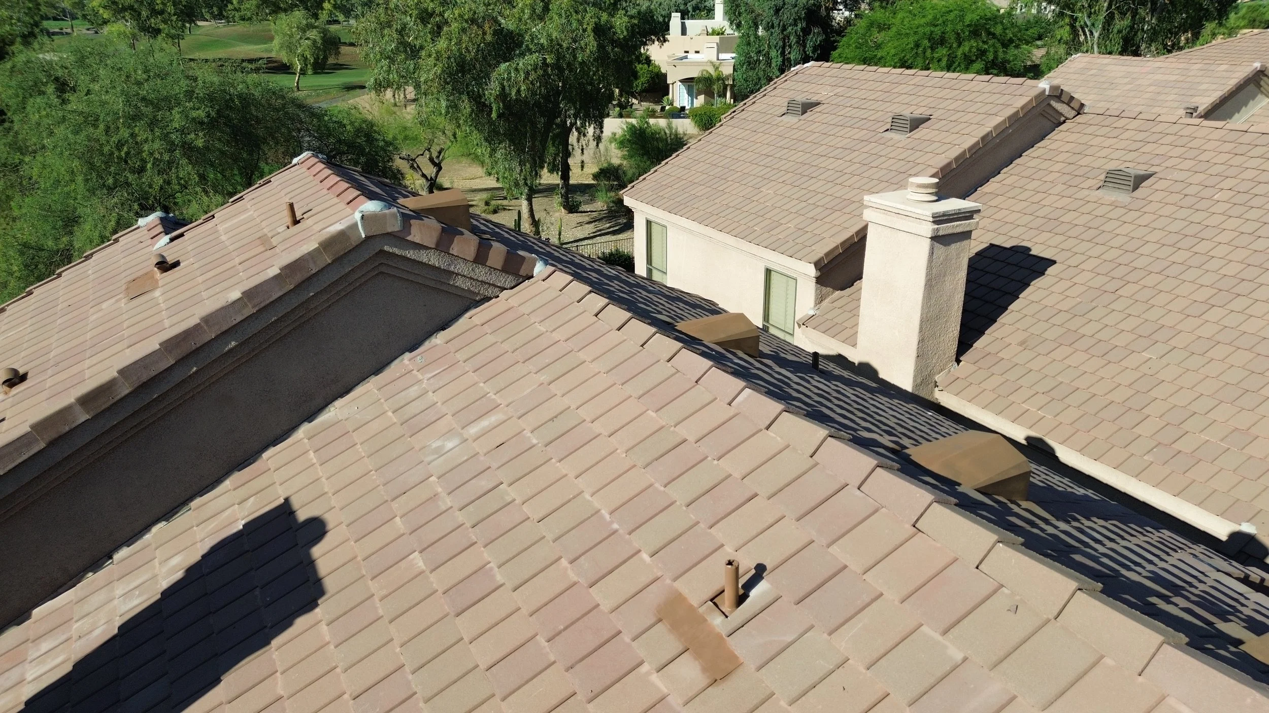  A roof's shingles (or tiles) are the top layer.  