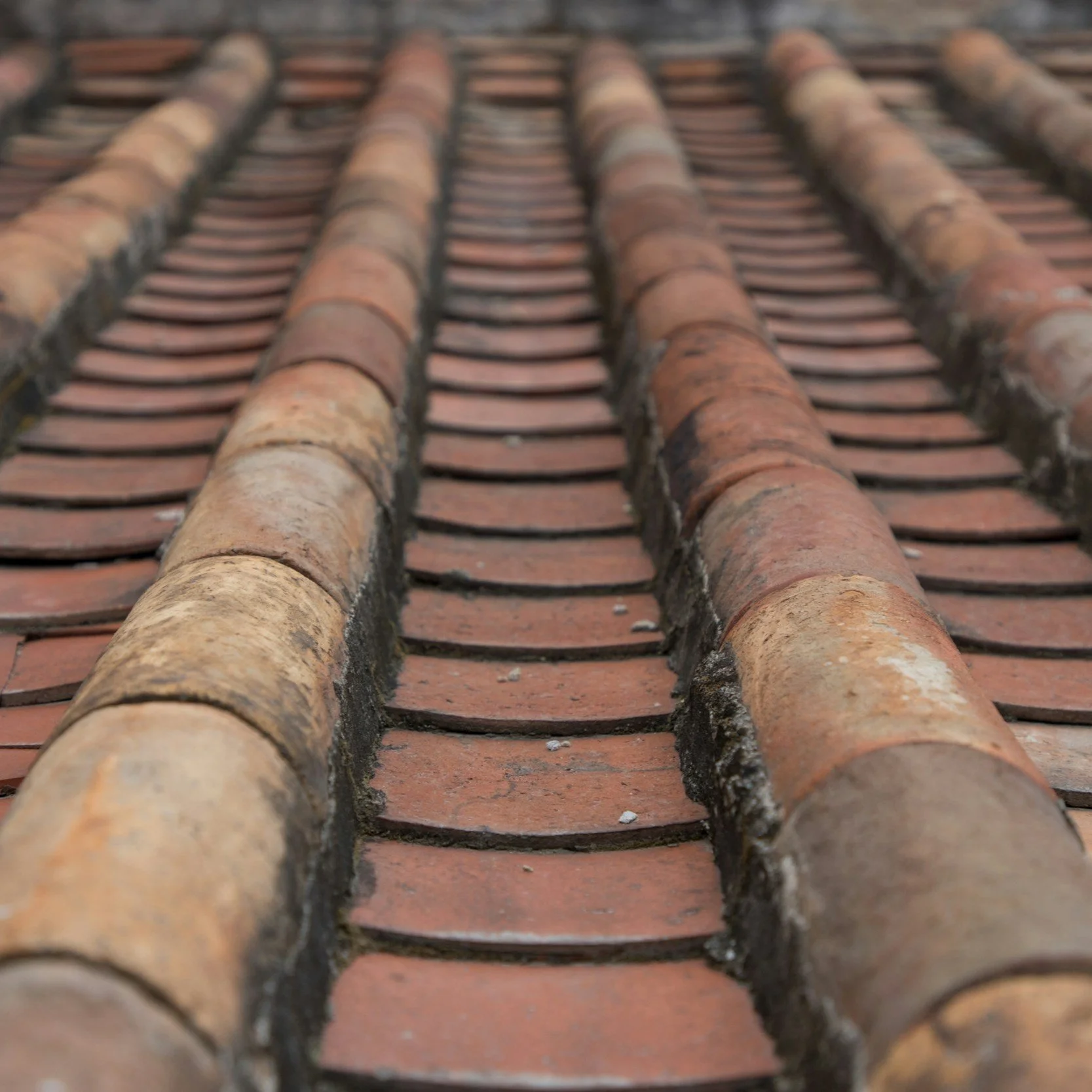 Annual professional inspections combined with visual inspections after severe weather events can help detect issues like loose or damaged shingles, leaks, or structural damage.